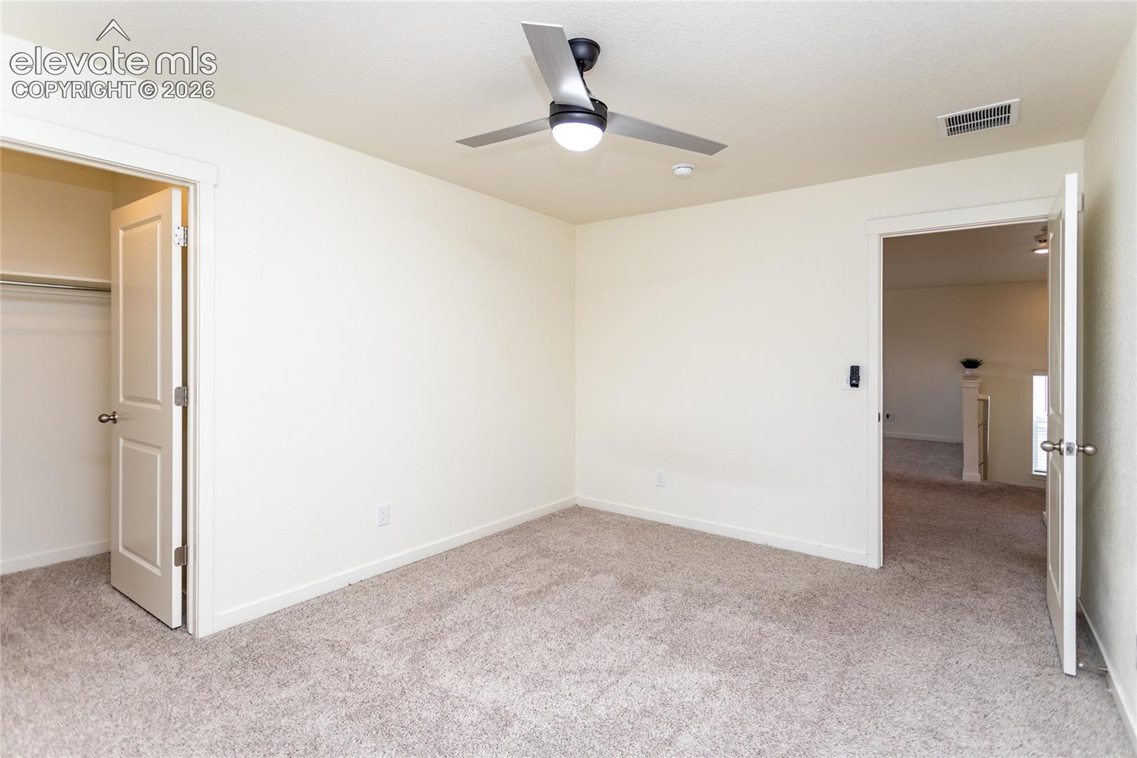 Bedroom 2 with a walk-in closet