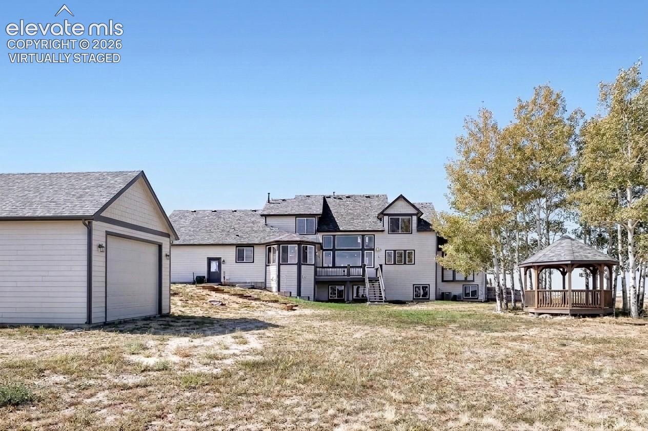 Virtually staged image. The outbuilding and gazebo shown are conceptual renderings depicting potential locations in the backyard. They do not currently exist on the property.