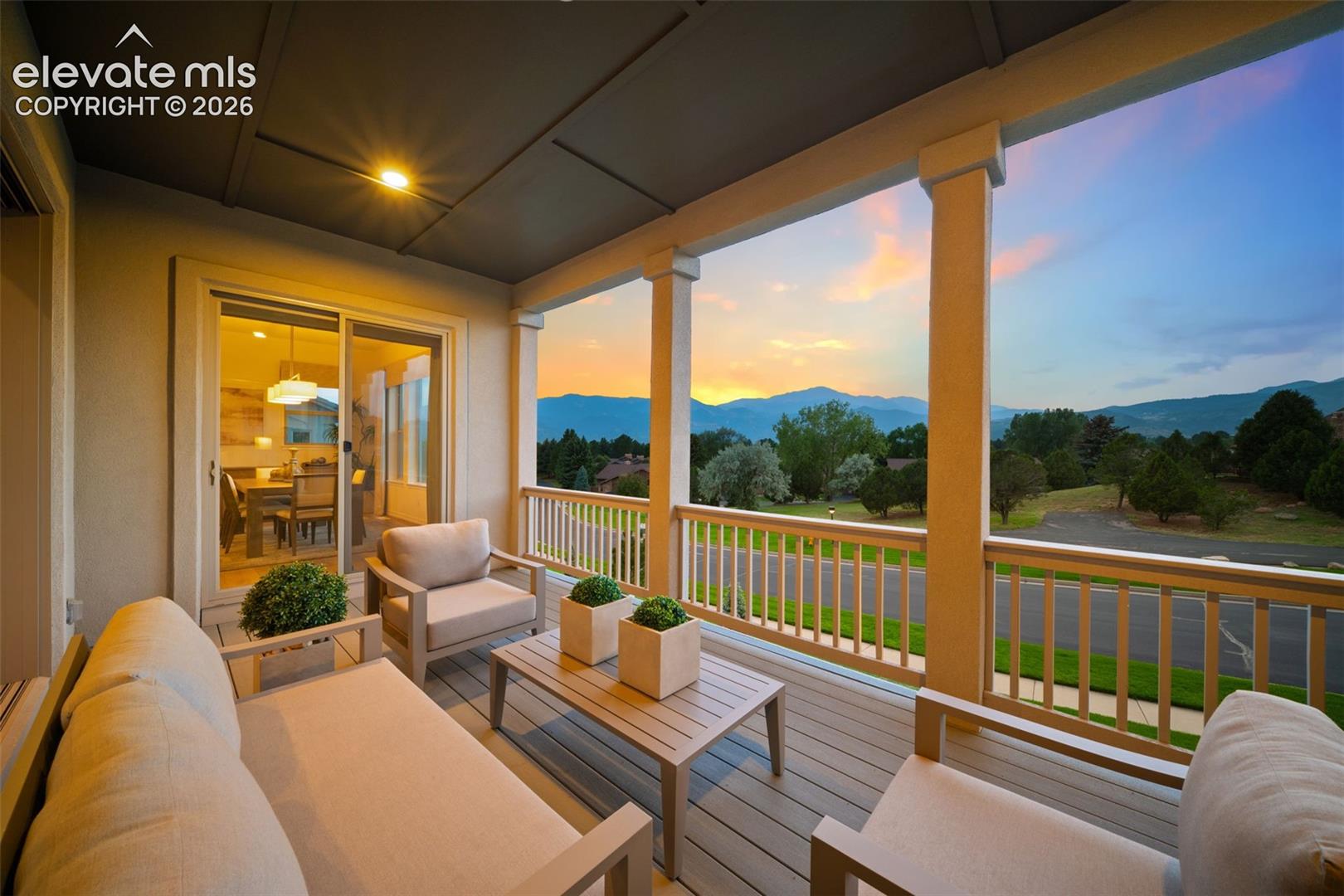 Covered outdoor deck with spectacular mountain and Pikes Peak views