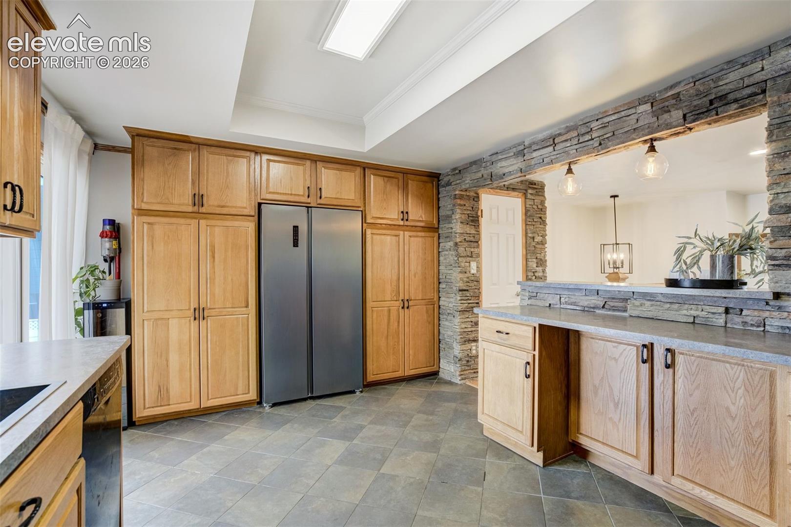 Slate tile, stone, and all the counter space you need for those crockpot meals. 