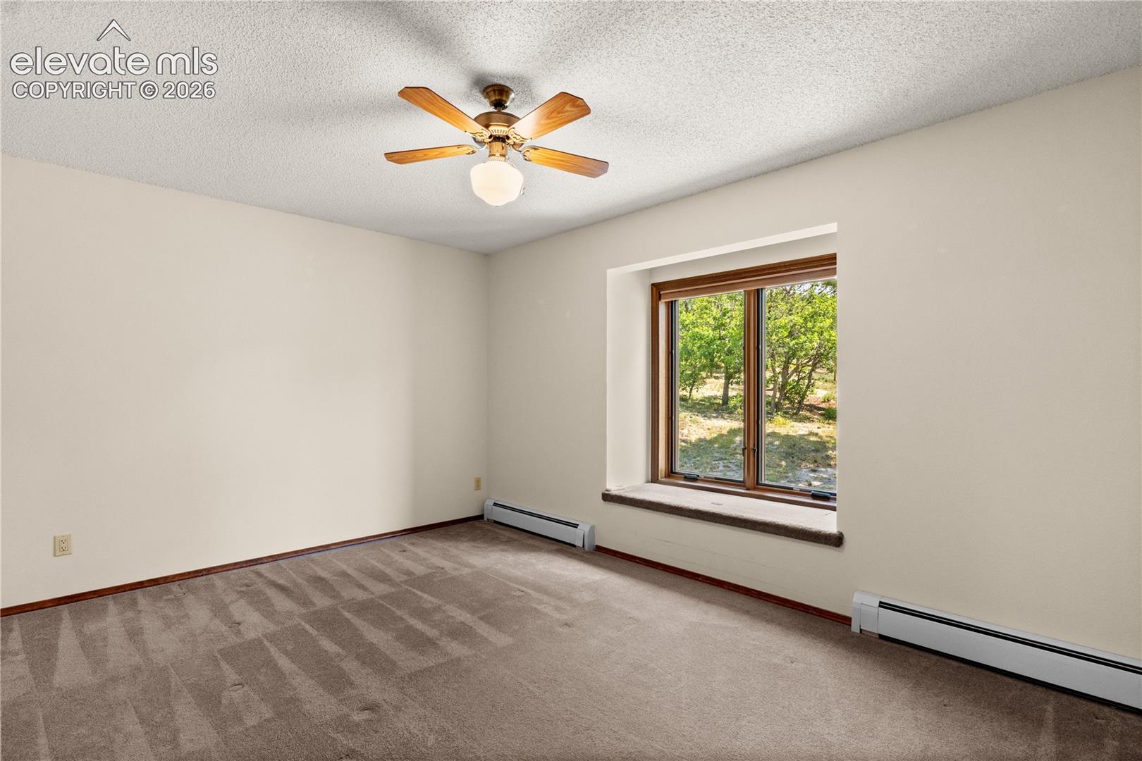 Upper level bedroom isbright and spacious.