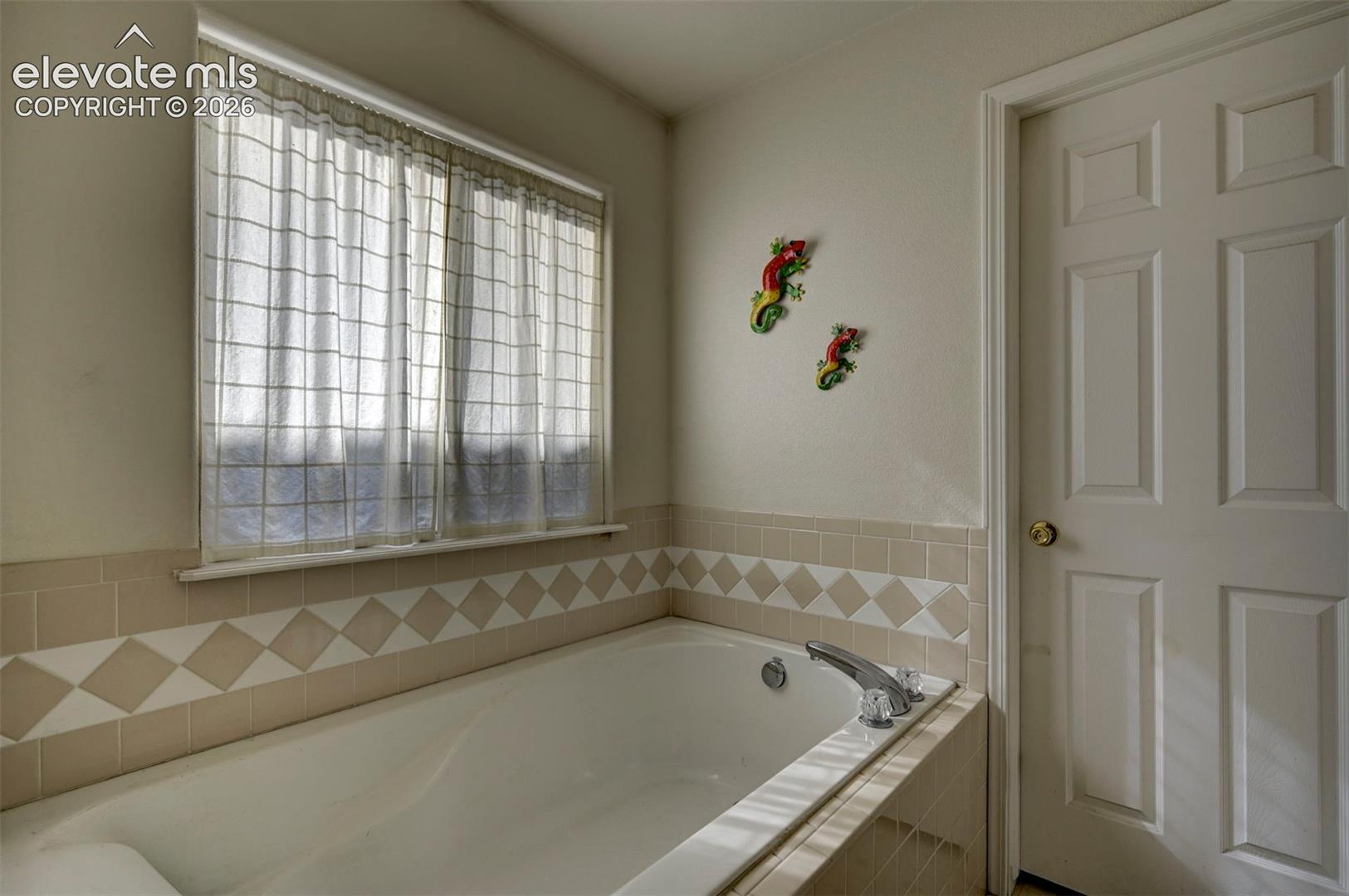 Soaking tub in Primary Bathroom.