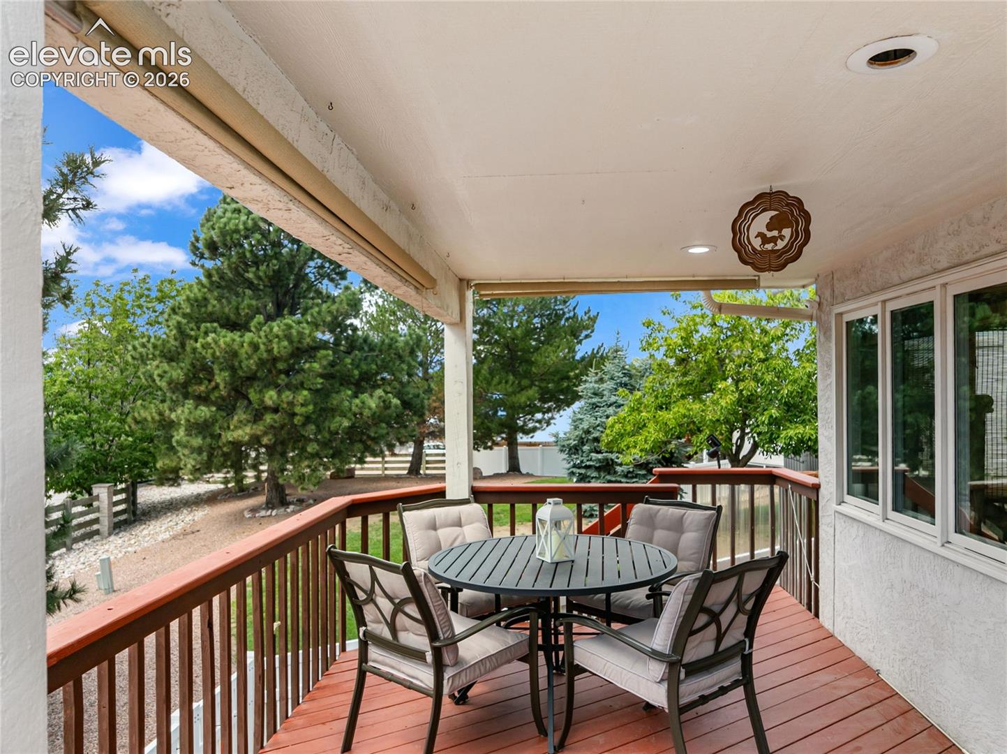 Enjoy mountain views on this covered deck with retractable sun shades!