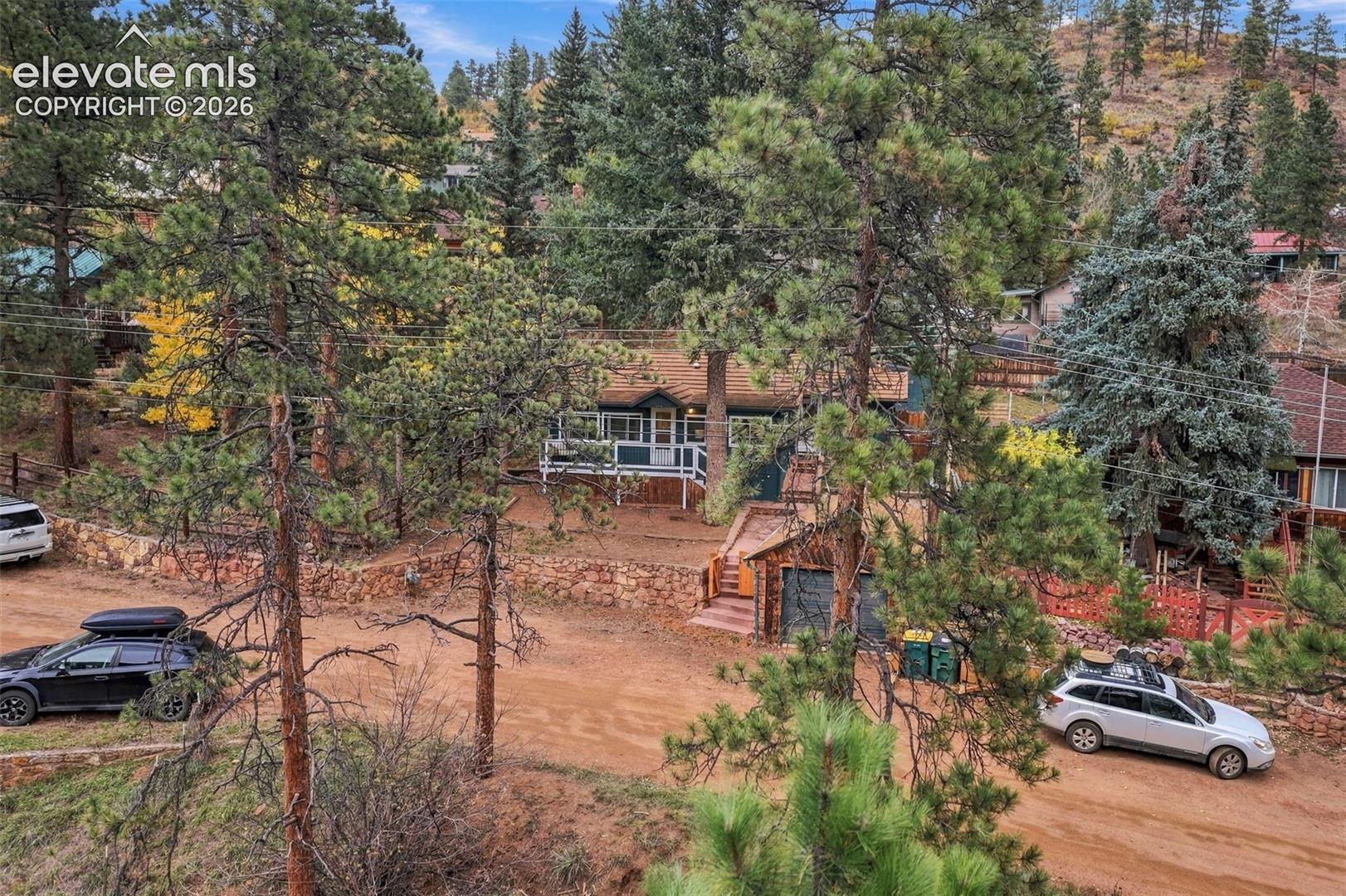 Aerial view of front of home with extra space for uncovered parking.