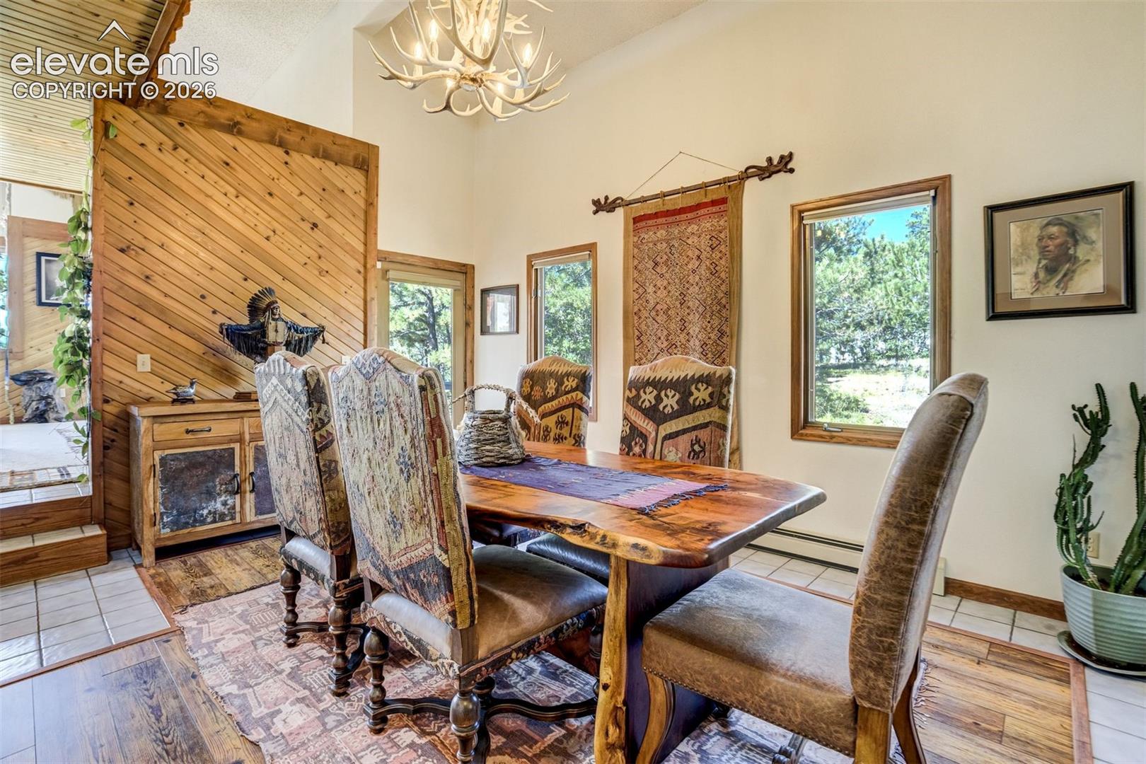 Dining room walks out to side deck. Custom built chandelier 