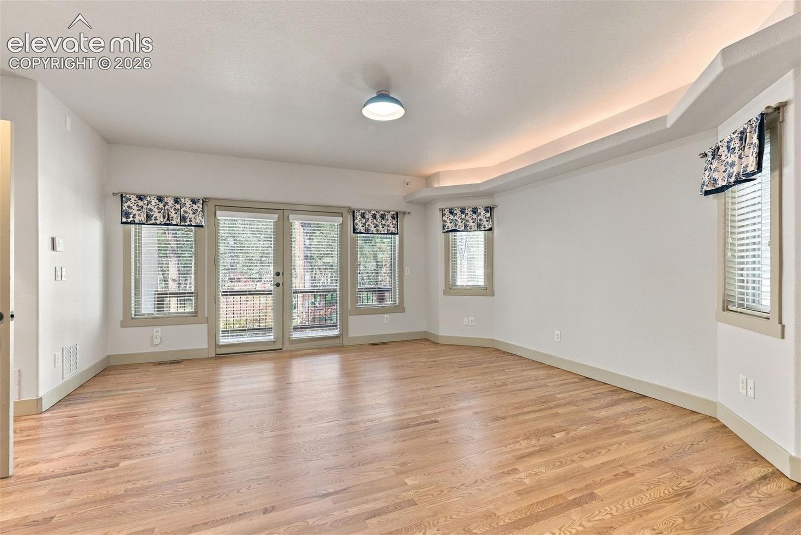Primary bedroom with walk out to martini balcony