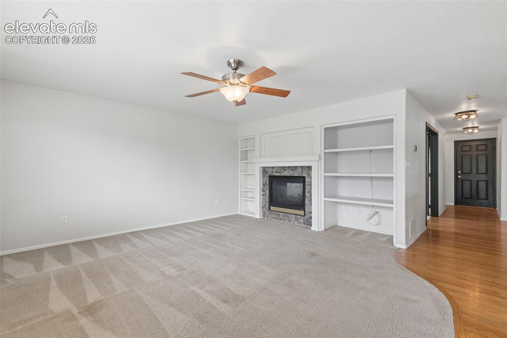 Fireplace, Built-In Shelving & Plenty of Room to Gather