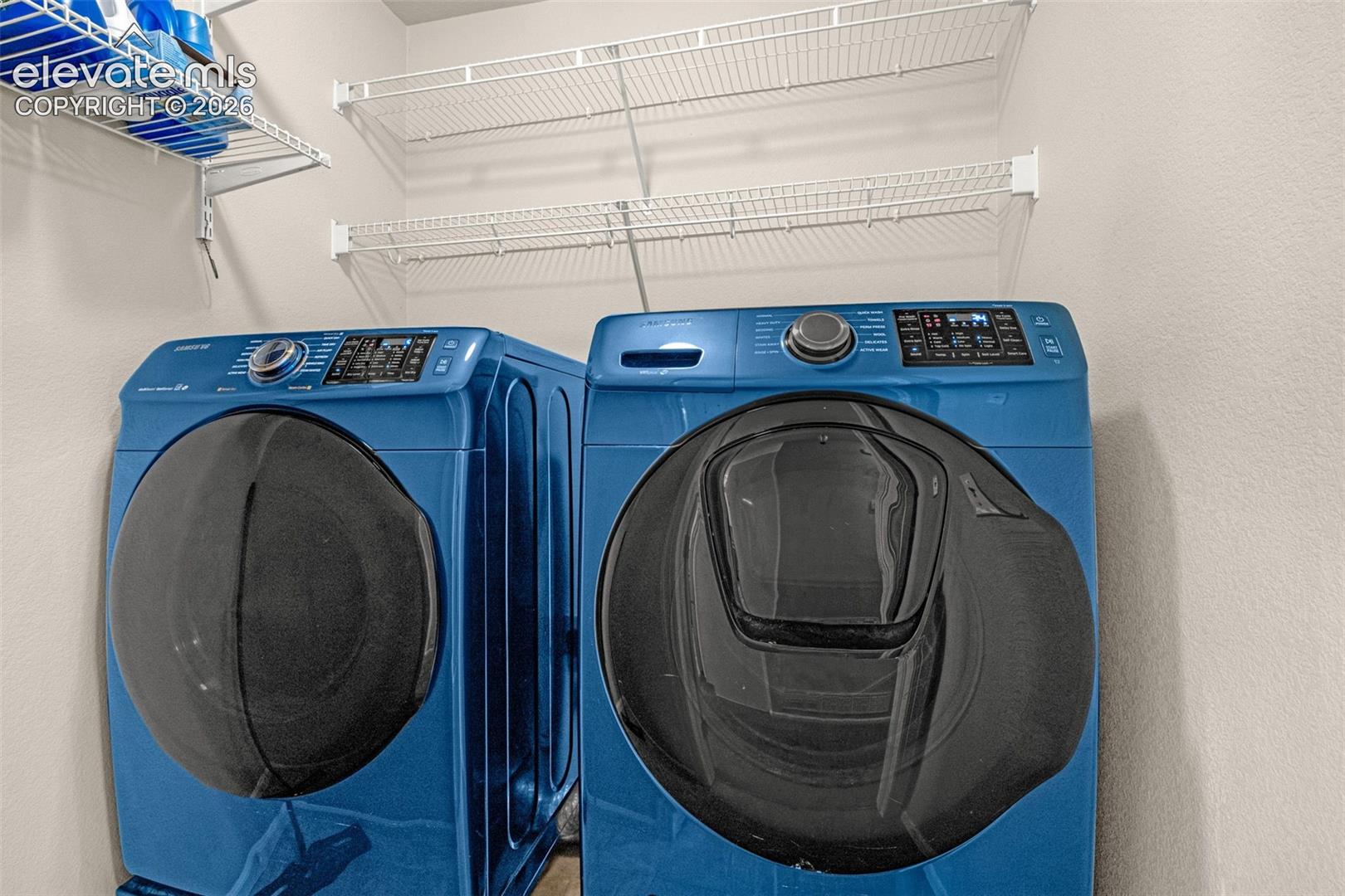 Laundry area with white wire shelving
