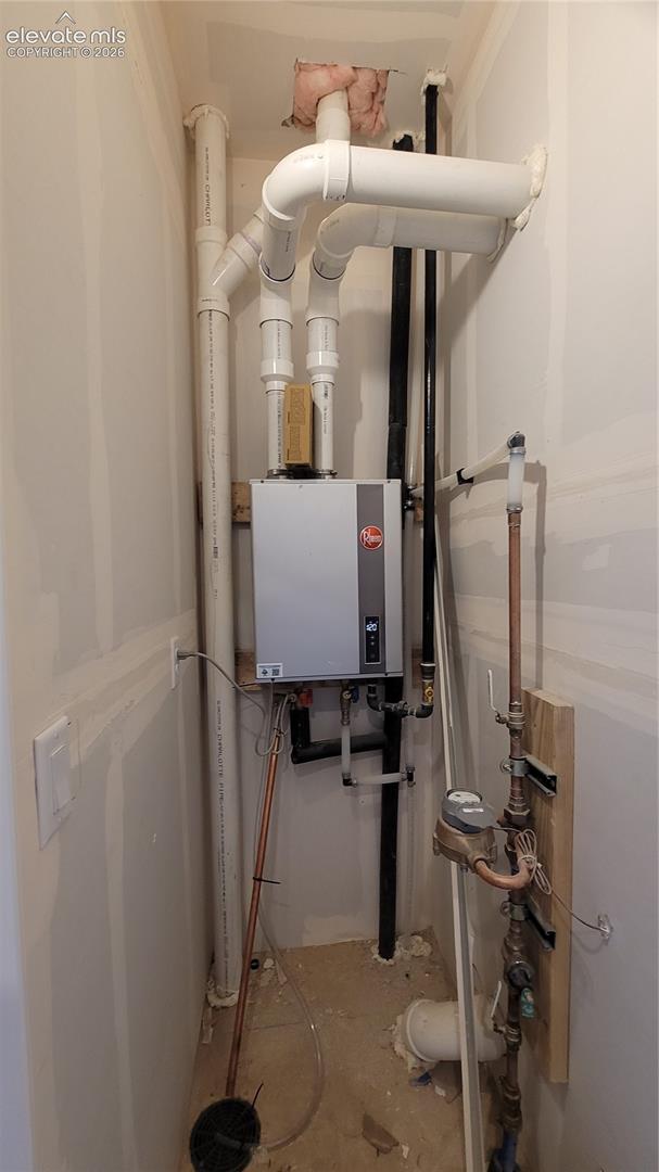 Utility closet at entry level with a tankless water heater! 