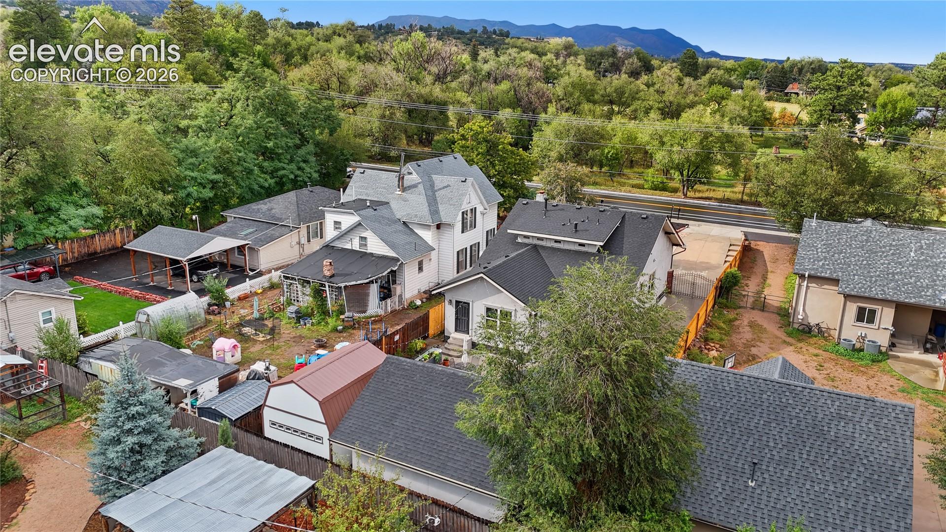 Aerial view showcasing multiple residential properties with varied architectural styles