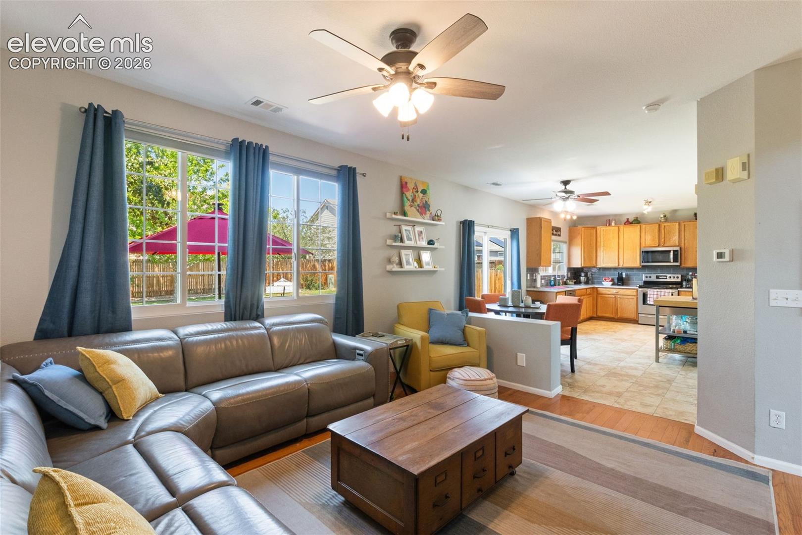 Family room looking towards kitchen. Large windows provide lots of light.