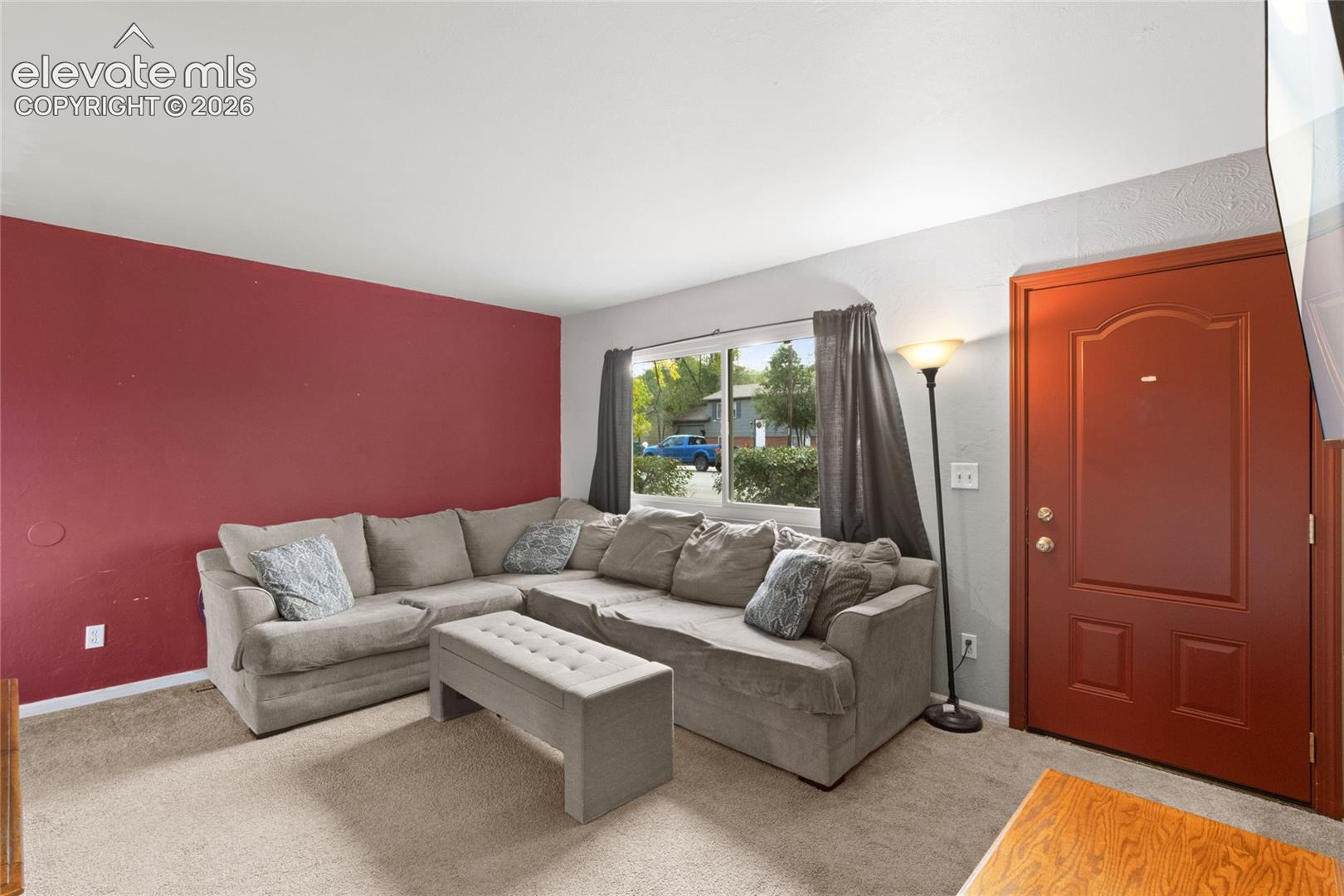 Living room with plenty natural light through new front windows