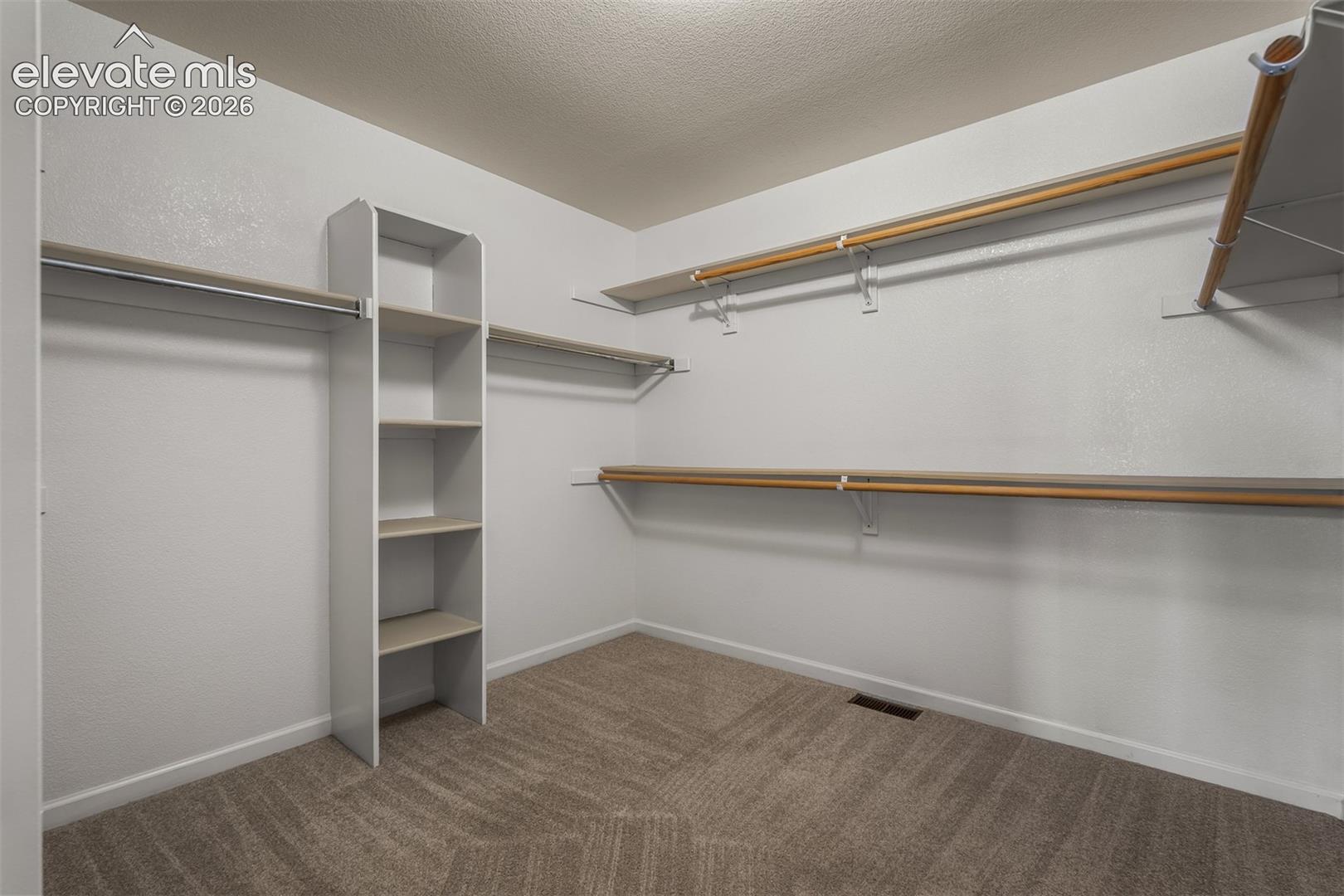 Walk In Spacious Closet In Primary Bedroom