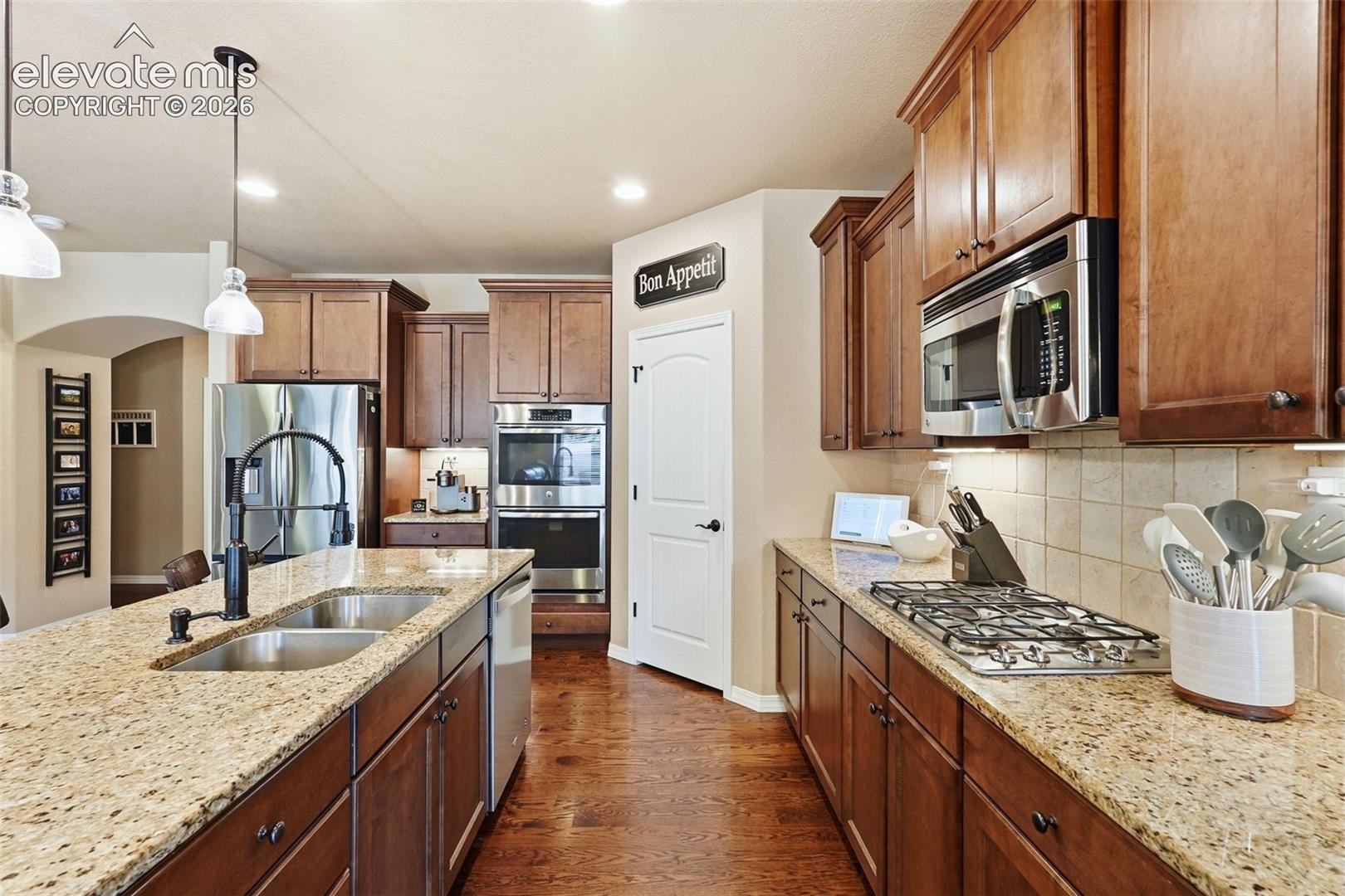 Gas range, double ovens, walk-in pantry, new sink faucet, and new stainless-steel refrigerator included!