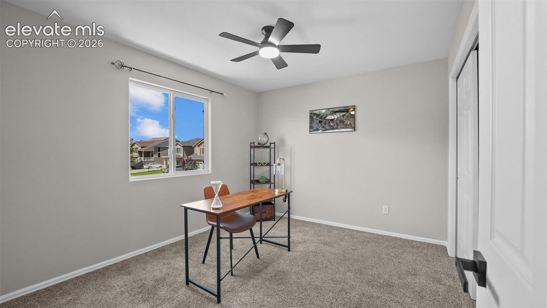Neutral paint palette, ceiling fan, and carpeted flooring