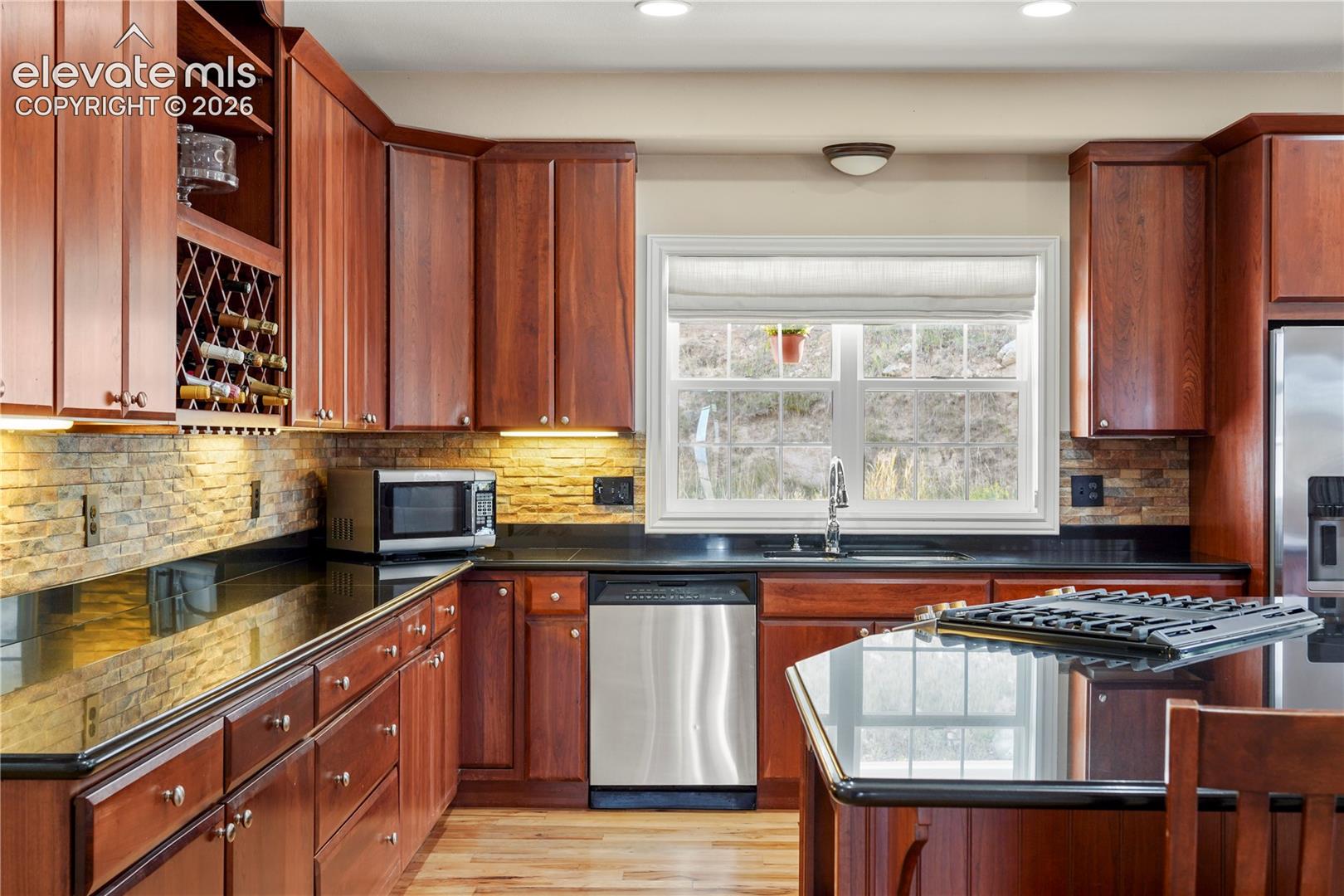 Stainless appliances include gas range.