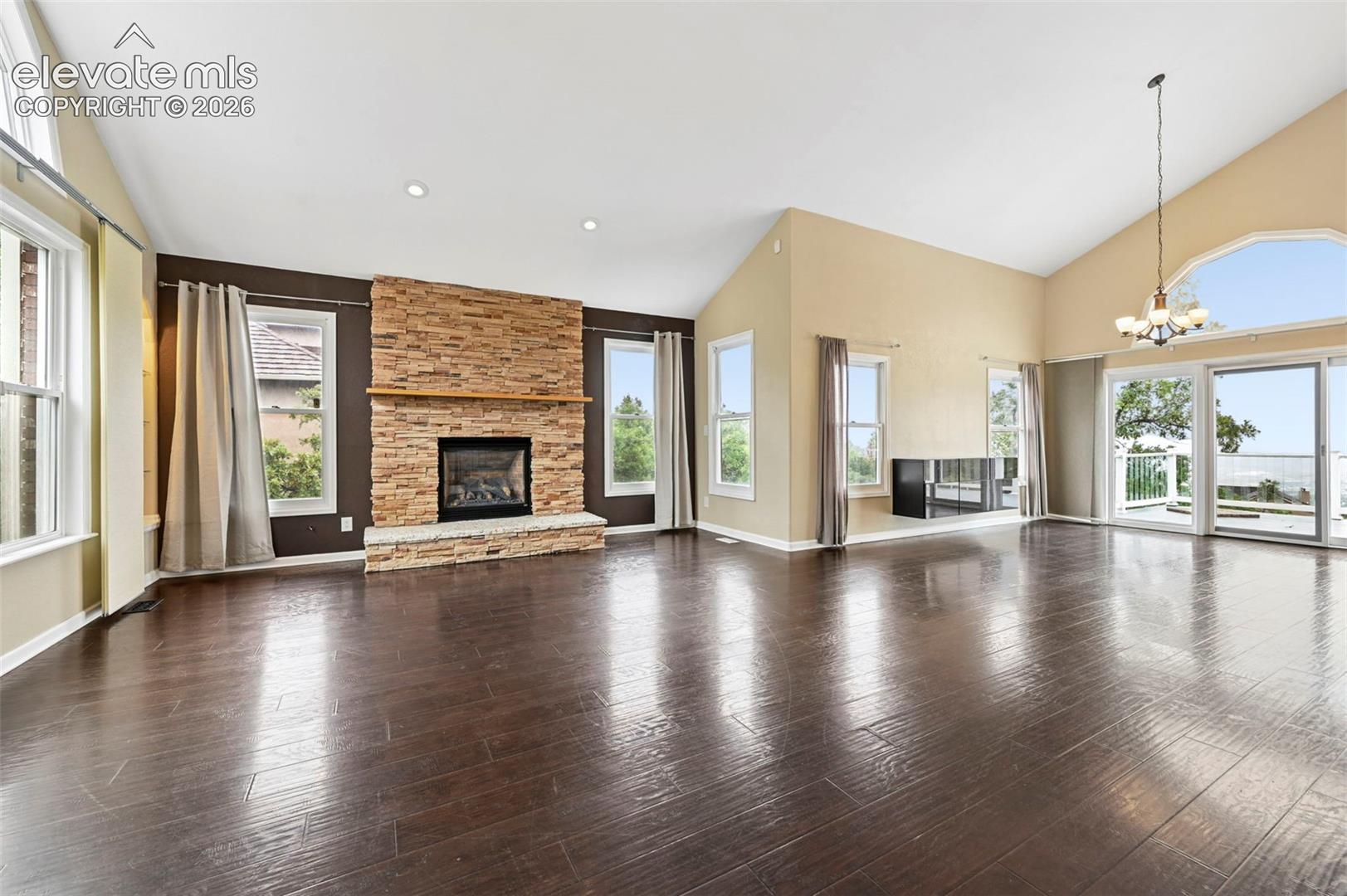 Unstaged Formal living room and dining room with walk out to large deck, overlooking the city!