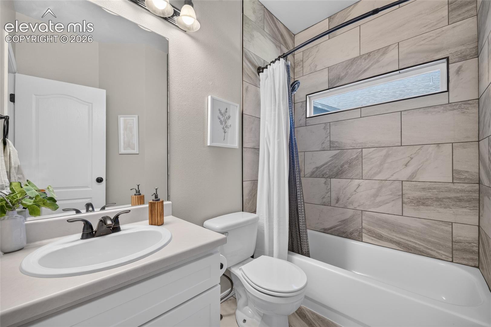 Main-level bath redone with new tile and fixtures