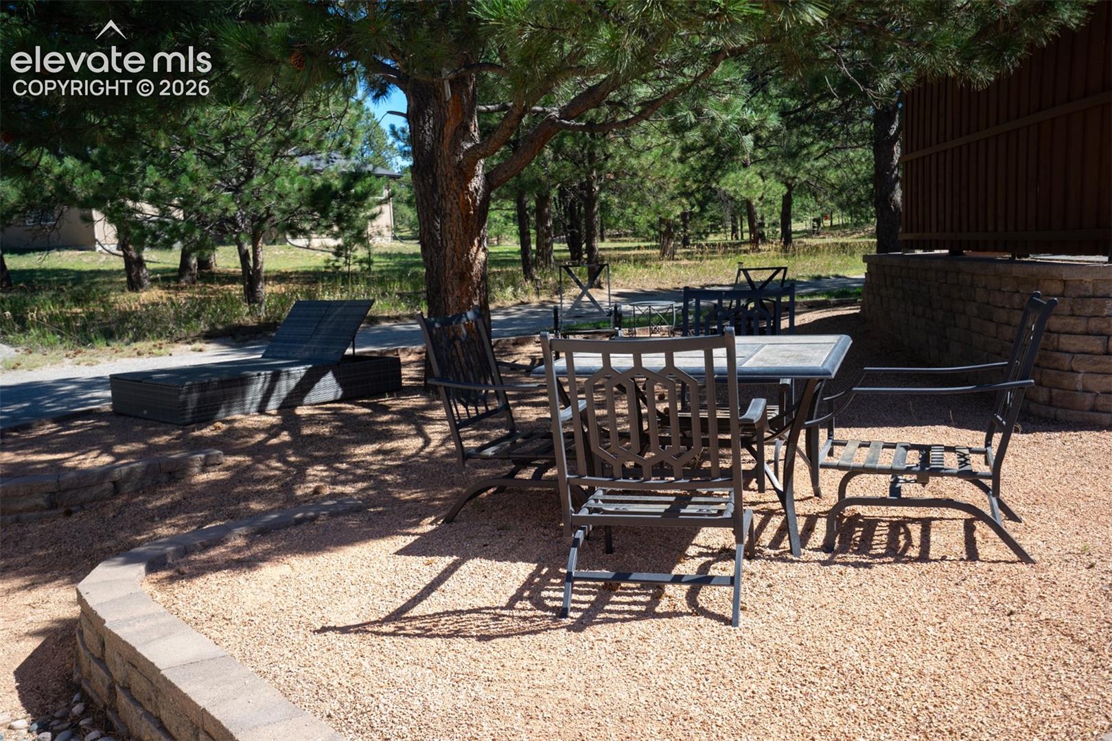 Another patio area is between the main house and the detached garage with great access from the basement