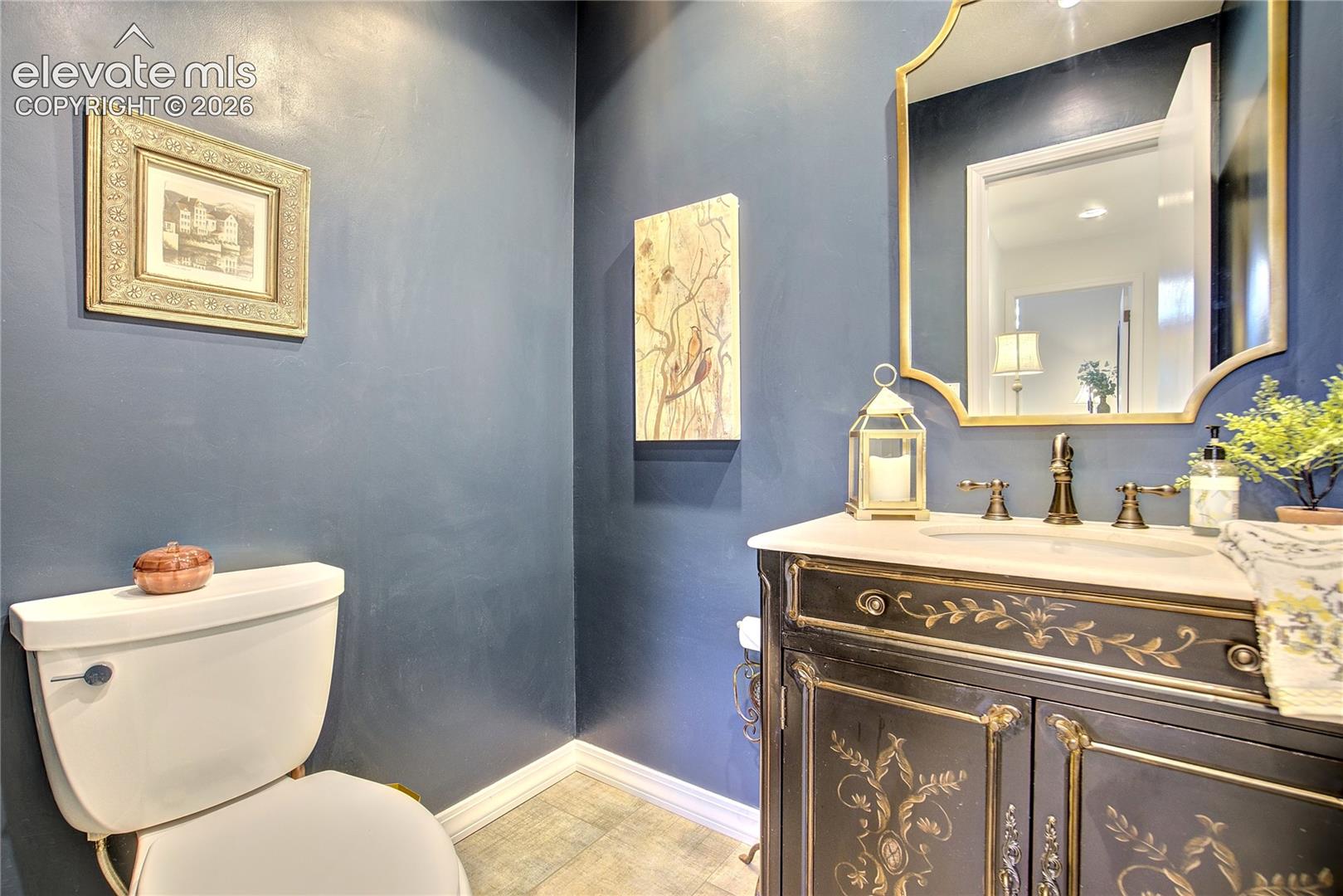 The updated main-level powder room adds another thoughtfully refreshed space for guests.