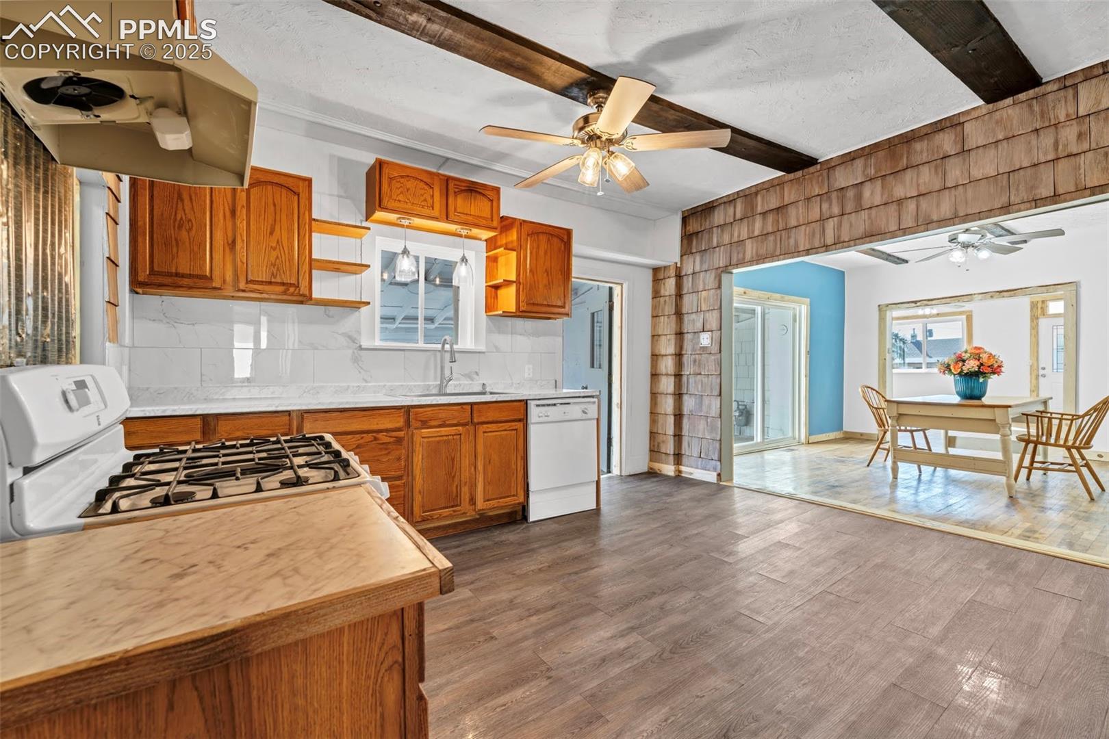 Kitchen opens to Dining Room and walks out to Screened in Porch