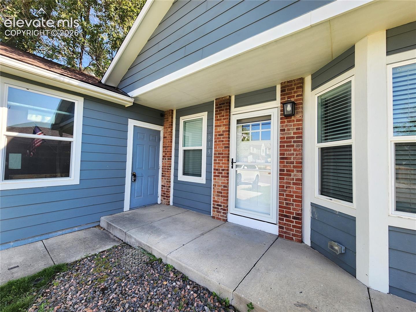 Covered front entry welcoming guests with clean lines and inviting details