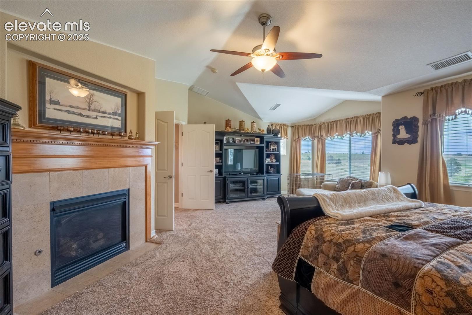 MAIN BEDROOM WITH FIREPLACE
