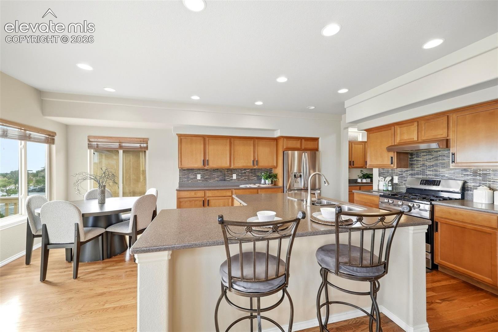 Eat in Kitchen with SS appliances, butlers pantry and hard wood flooring