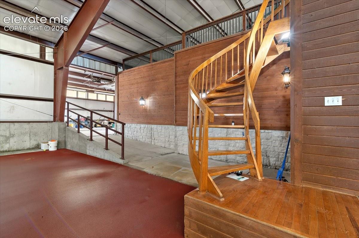 Spiral staircase leading up to an unfinished observation area that could be finished to ?????