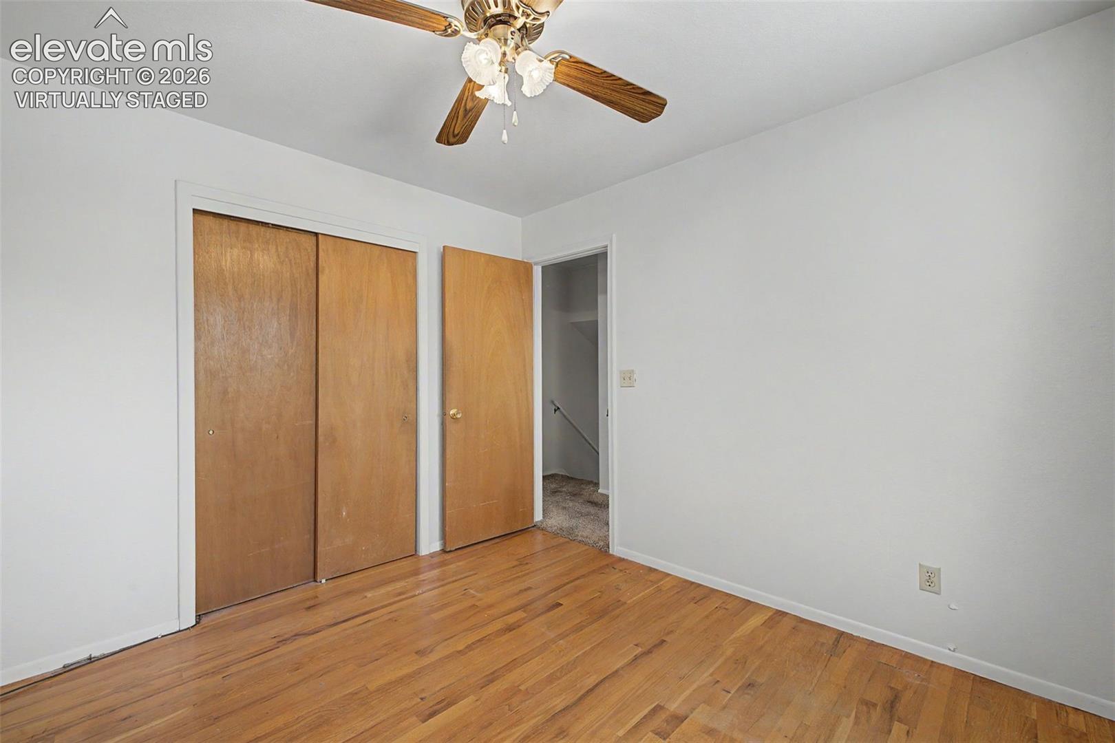 Virtually Staged with flooring - wood flooring under carpet