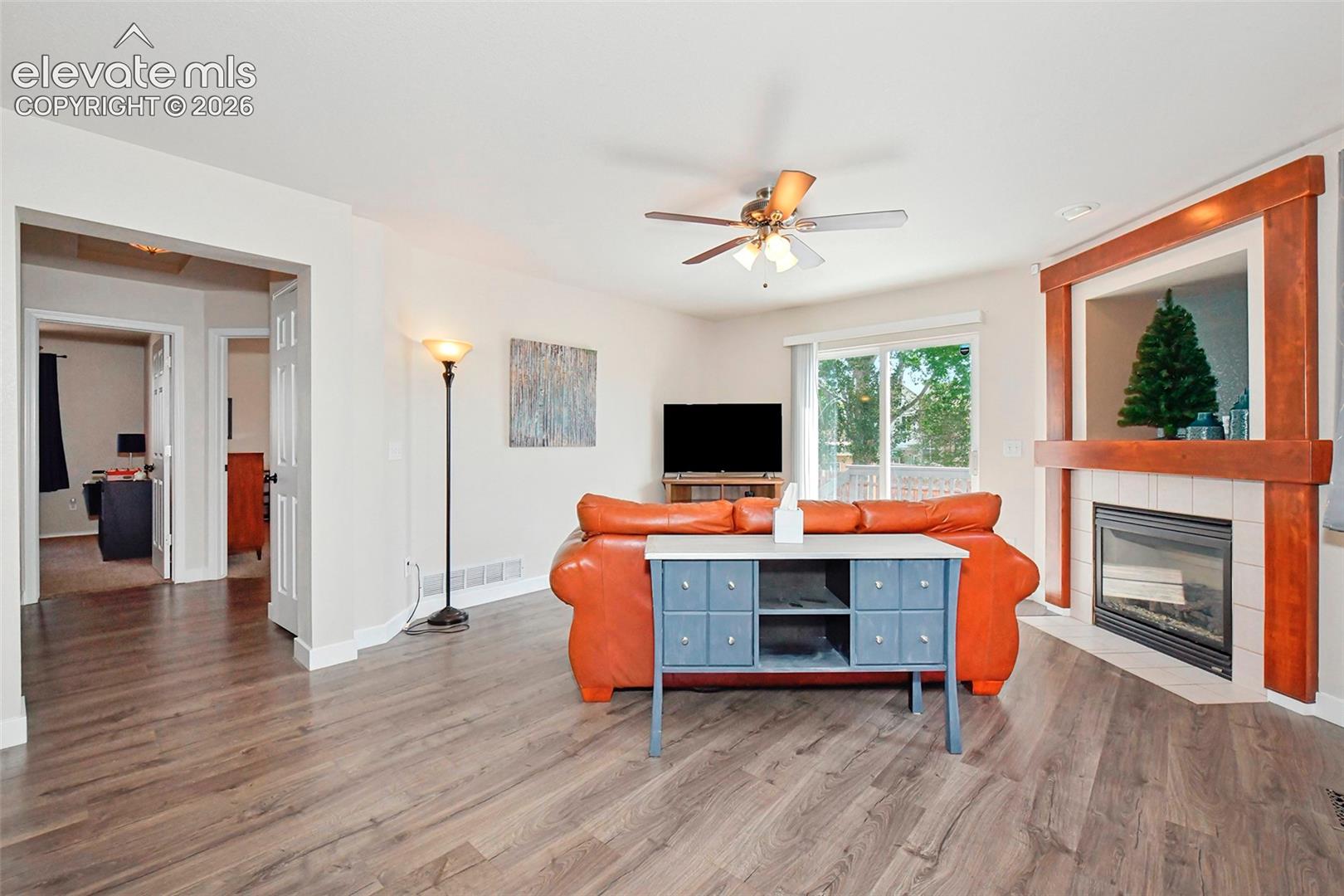 Living room with view of hallway to 2 bedrooms and main level bath.