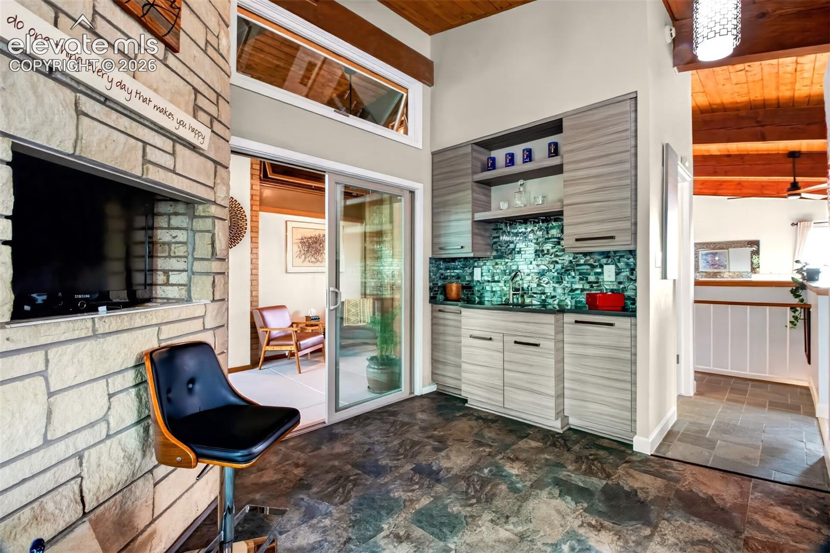 In one corner of the kitchen there is a wet bar perfect for entertaining