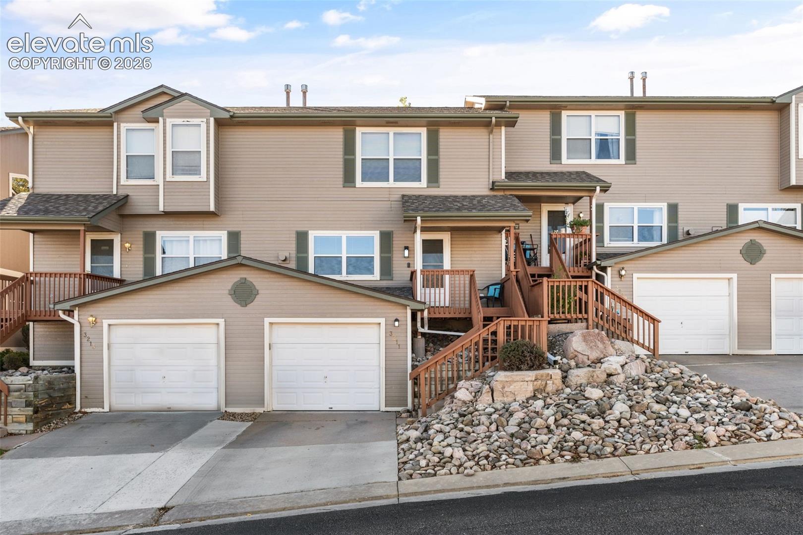 This thoughtfully updated Colorado Springs townhome offers 2 bedrooms (both with walk in closets), 3 bathrooms, and comfortable living spaces in a convenient location. The living room features a gas fireplace for those cold nights.  With numerous recent improvements already completed, this home is ready for its next owner.Fresh interior paint and all-new lighting throughout create a bright, inviting atmosphere, while carpeting replaced in 2023 adds comfort and warmth. Additional improvements include new window screens, dishwasher, and toilets installed in 2023, and a new furnace in 2024.  The front porch was recently renovated by the HOA, enhancing the home's welcoming entrance. Appliances are included, adding convenience and value for the next owner. Enjoy the convenience of a dedicated garage space and an HOA that covers trash service, covenant enforcement, snow removal, common utilities, and insurance, helping simplify everyday maintenance and upkeep.  The guest parking is ample and close to the front door!For added peace of mind, the property also includes a transferable home warranty valid through 2028, offering valuable protection for the next owner.Conveniently situated with access to shopping, dining, and everyday amenities, this townhome combines thoughtful updates, practical features, and the benefits of HOA-maintained living.