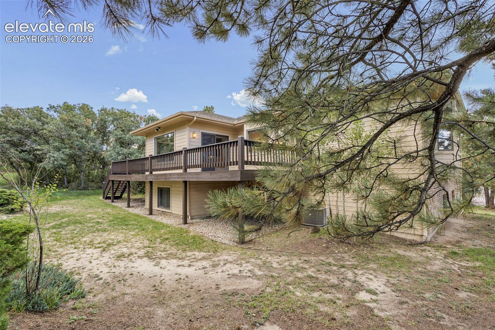 Expansive outdoor deck with dark wood railing
