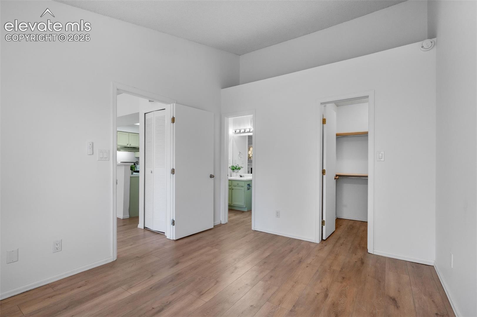 Doors (Left to right) living space, bathroom, & walk-in closet