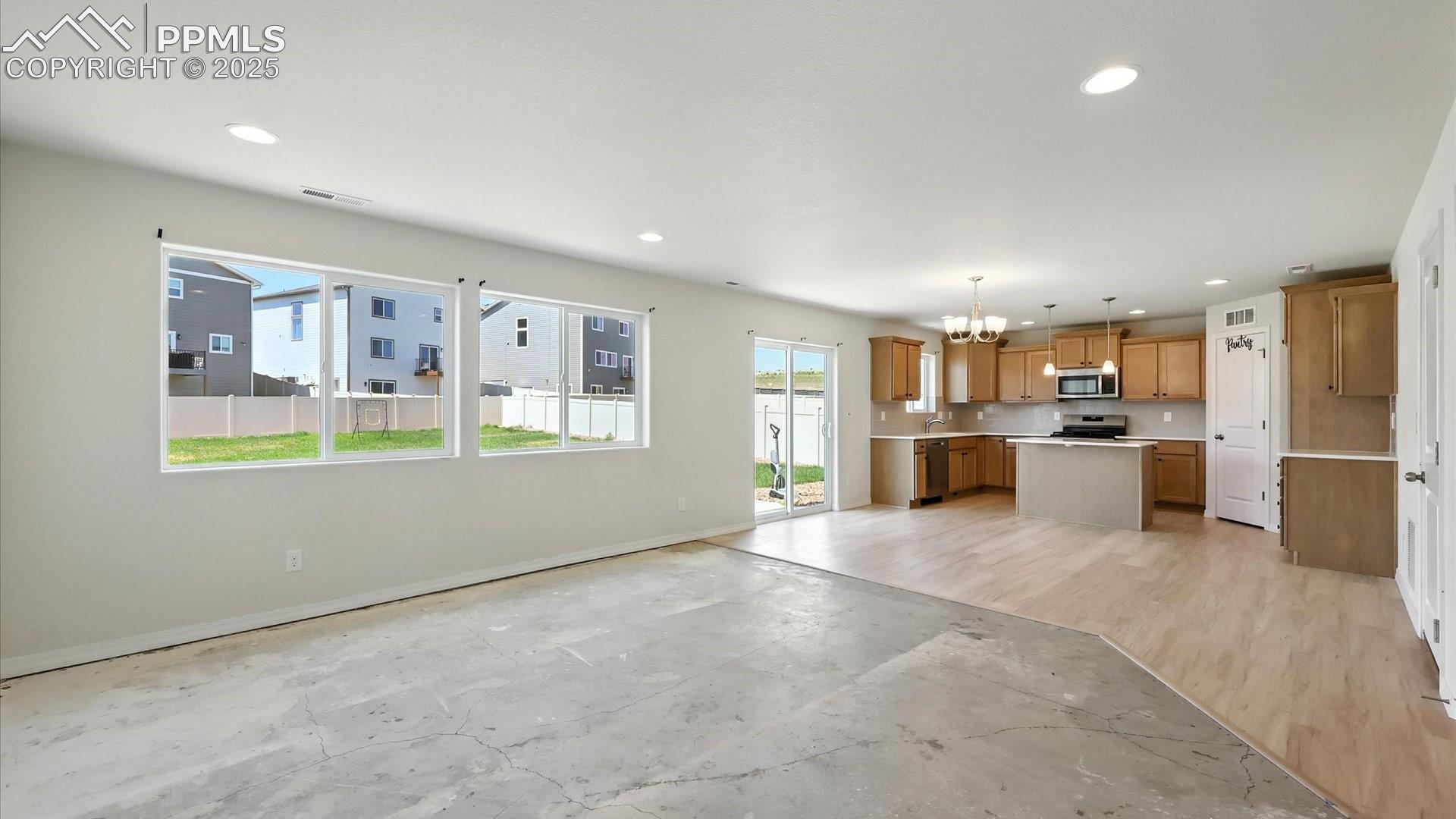 Open floor plan where one room flows effortlessly into another.