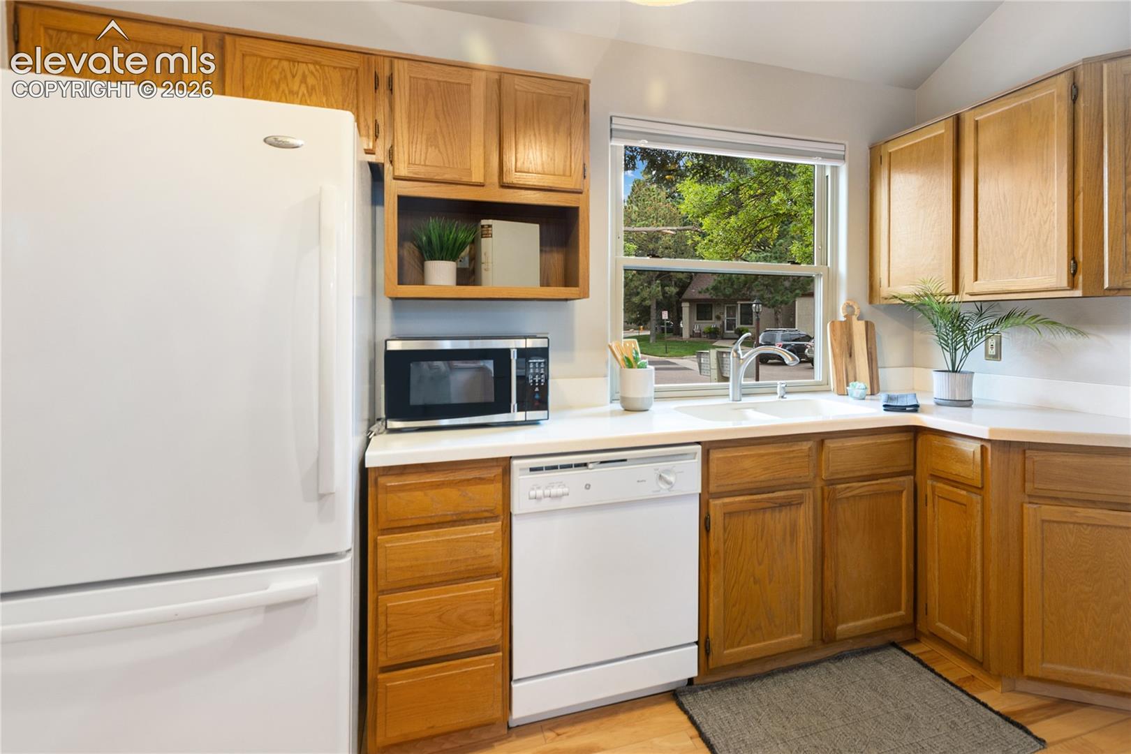 Cute kitchen with a window out front