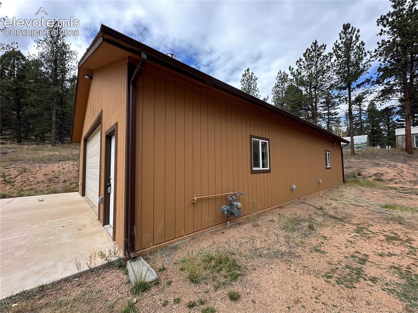 Natural gas for heat. Concrete apron. Exterior electrical outlets.