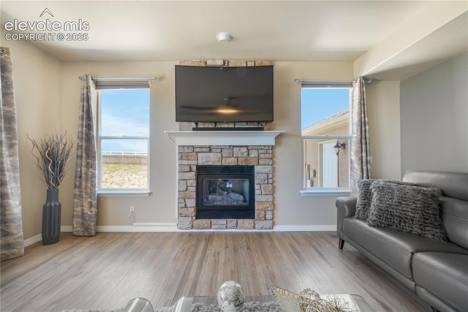 Spacious Family Room with Gas Fireplace and Natural Light 