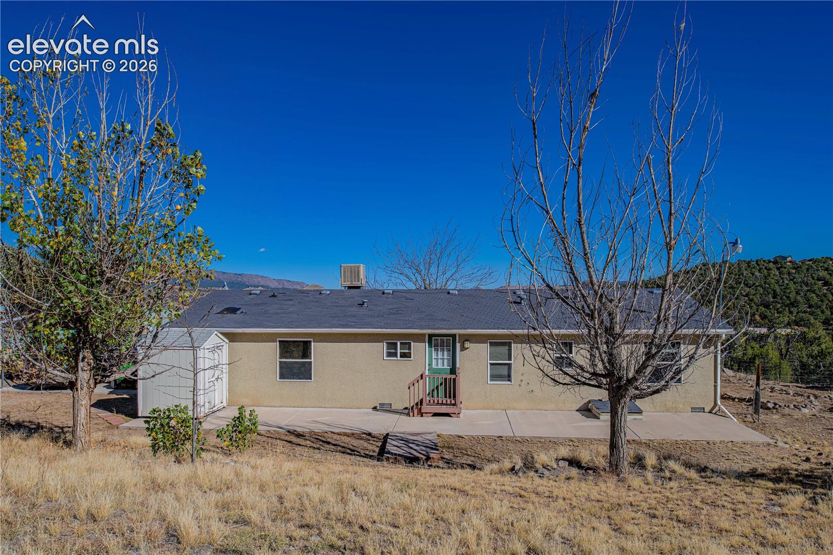 Rear view of property with a patio area