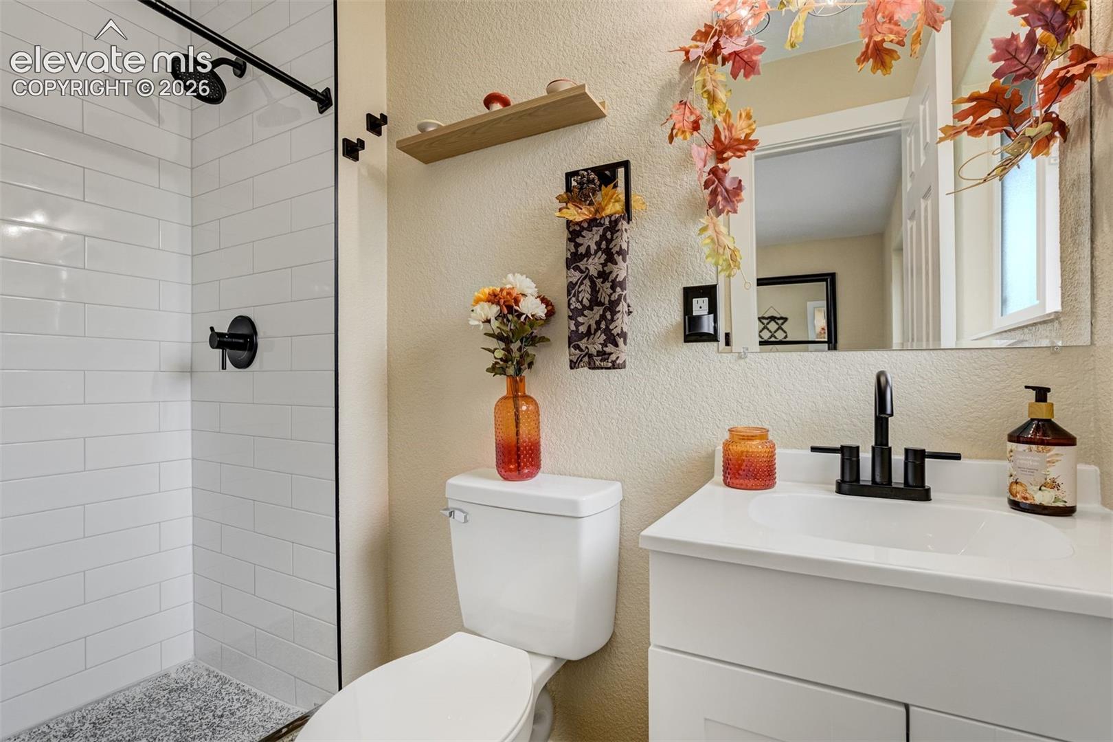 Connected bath with beautiful walk-in shower.