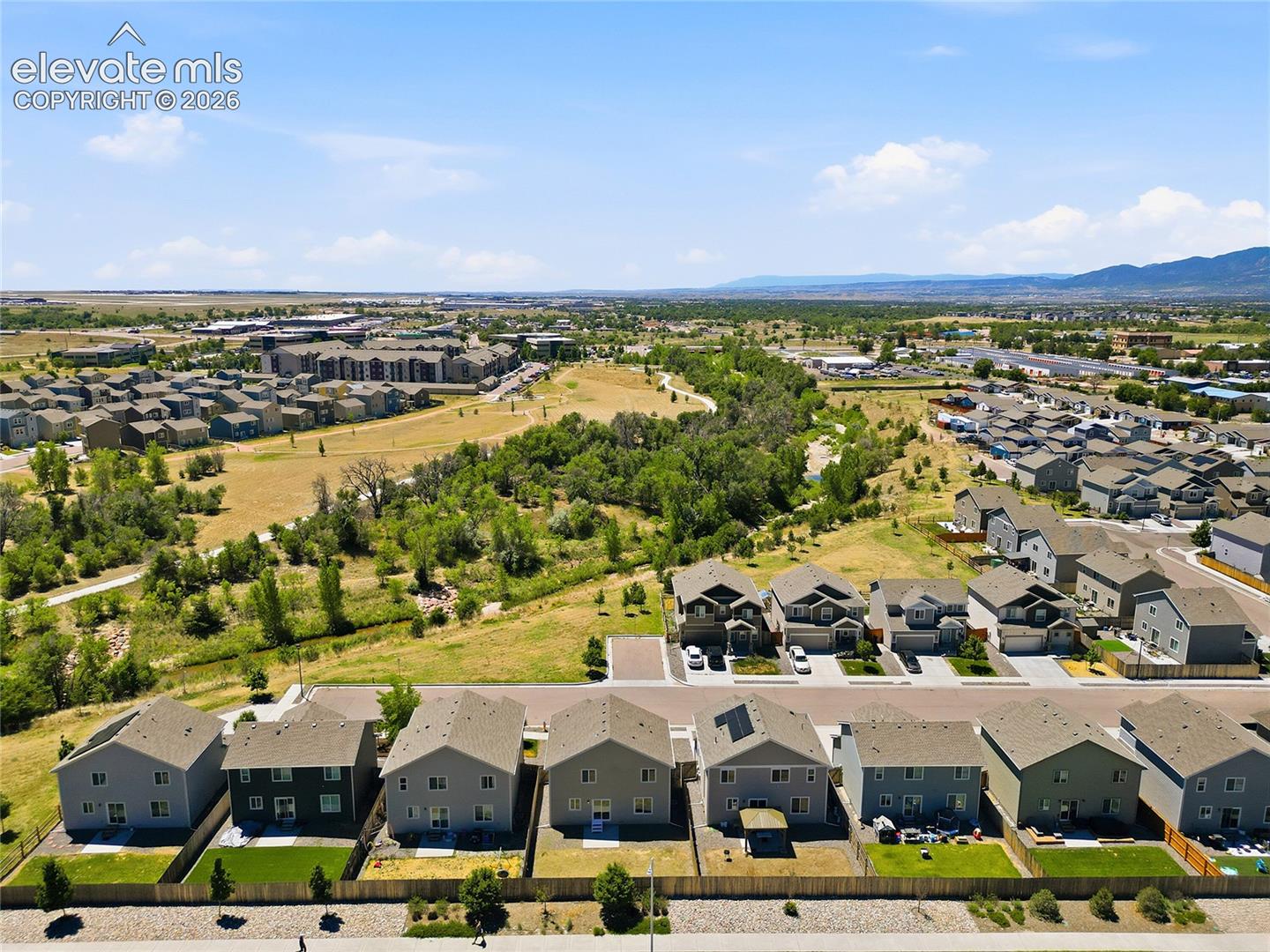 Aerial perspective showcasing a residential development with varied housing styles