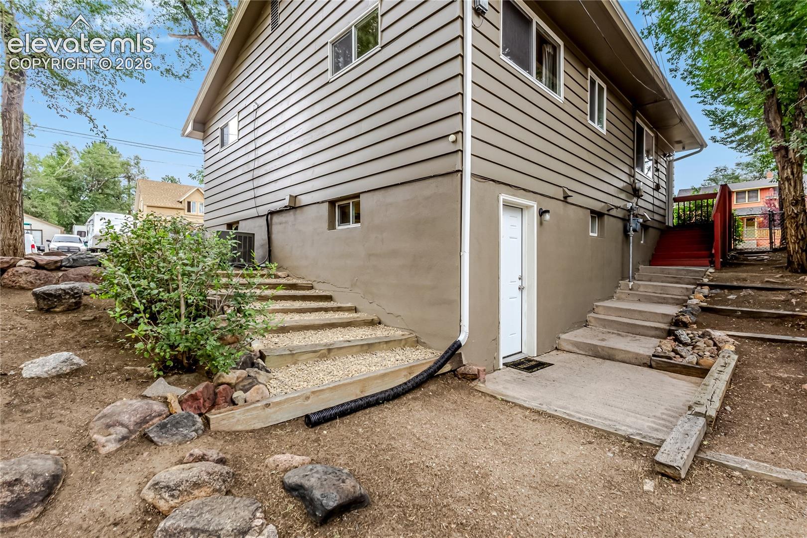 Back of the home showing the entry to the lower level