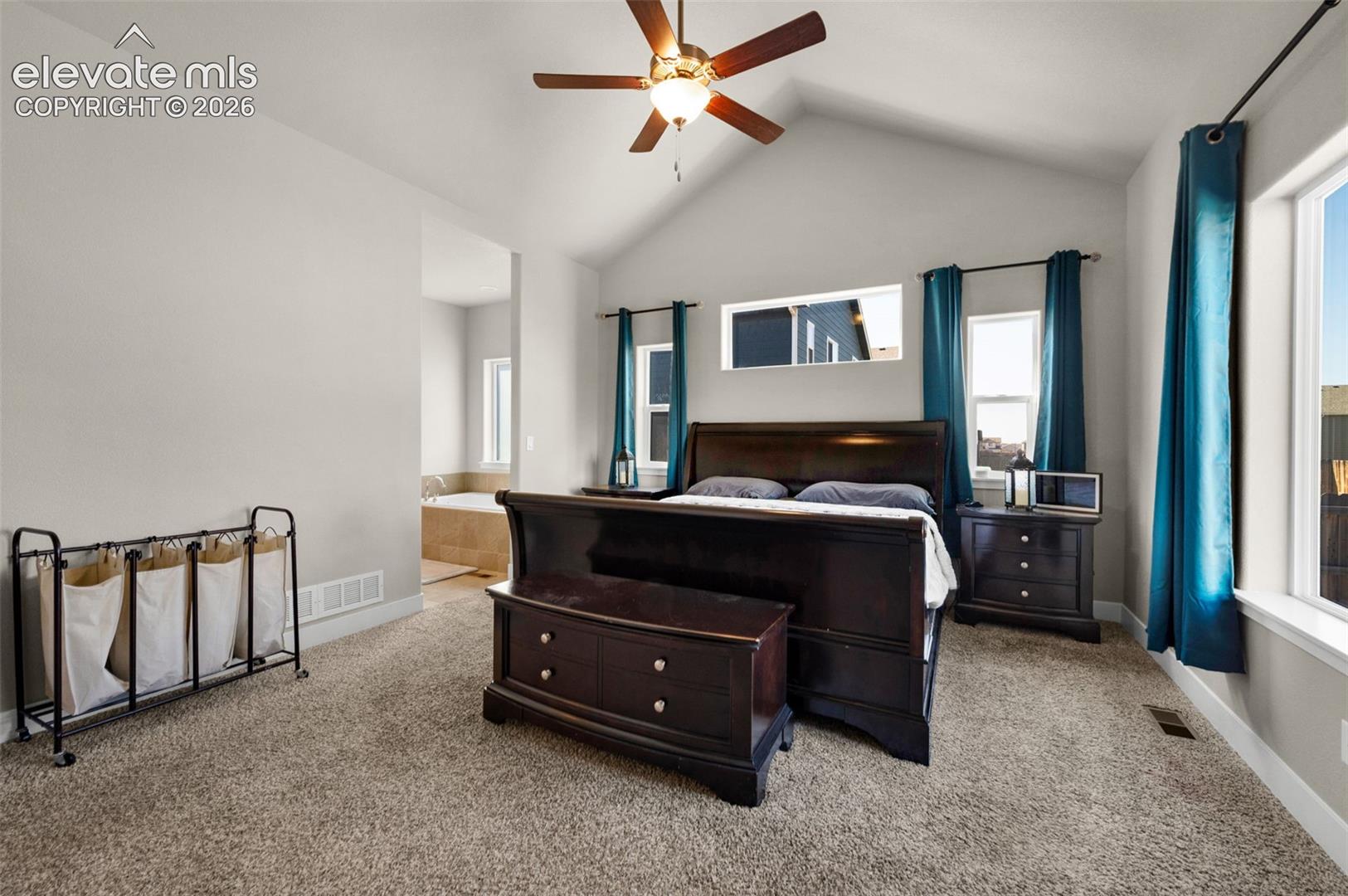 Notice the ceiling fan in the vaulted ceiling