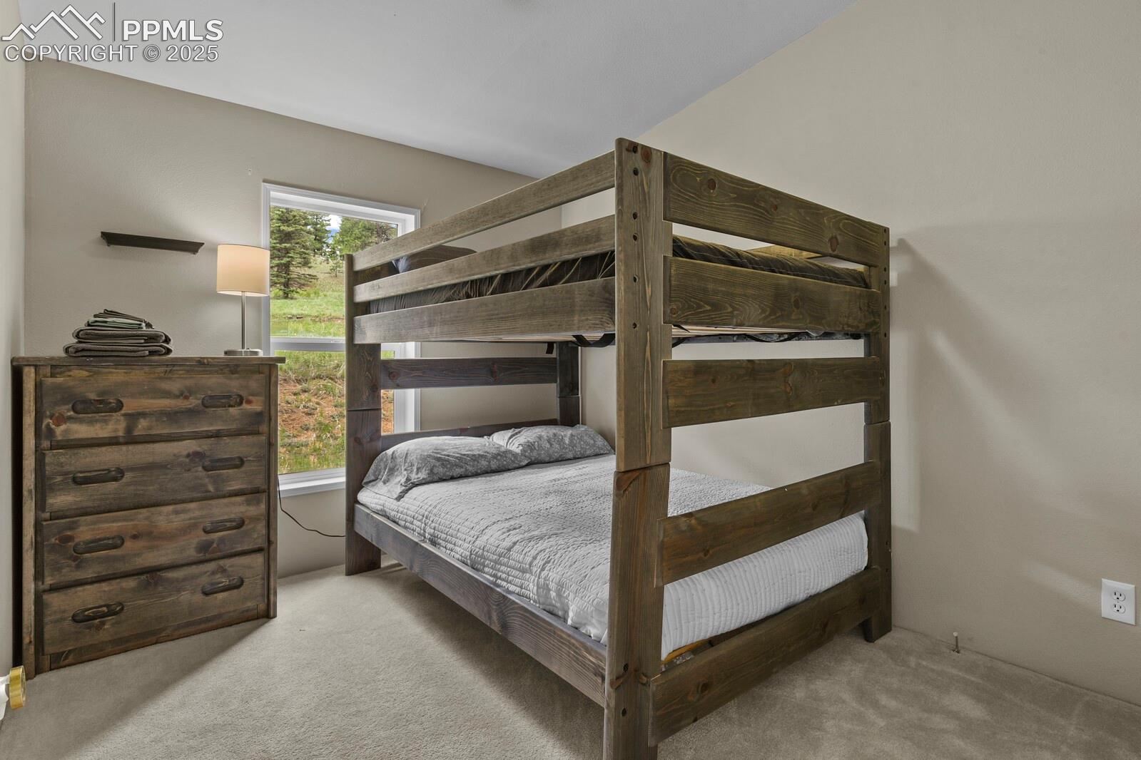 Bedroom with light colored carpet