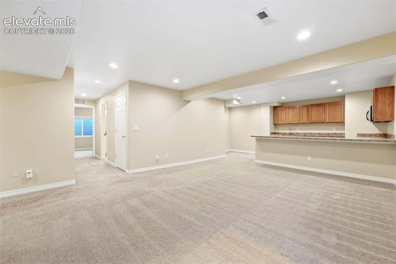Warm Recessed Lighting Throughout Basement Family Room