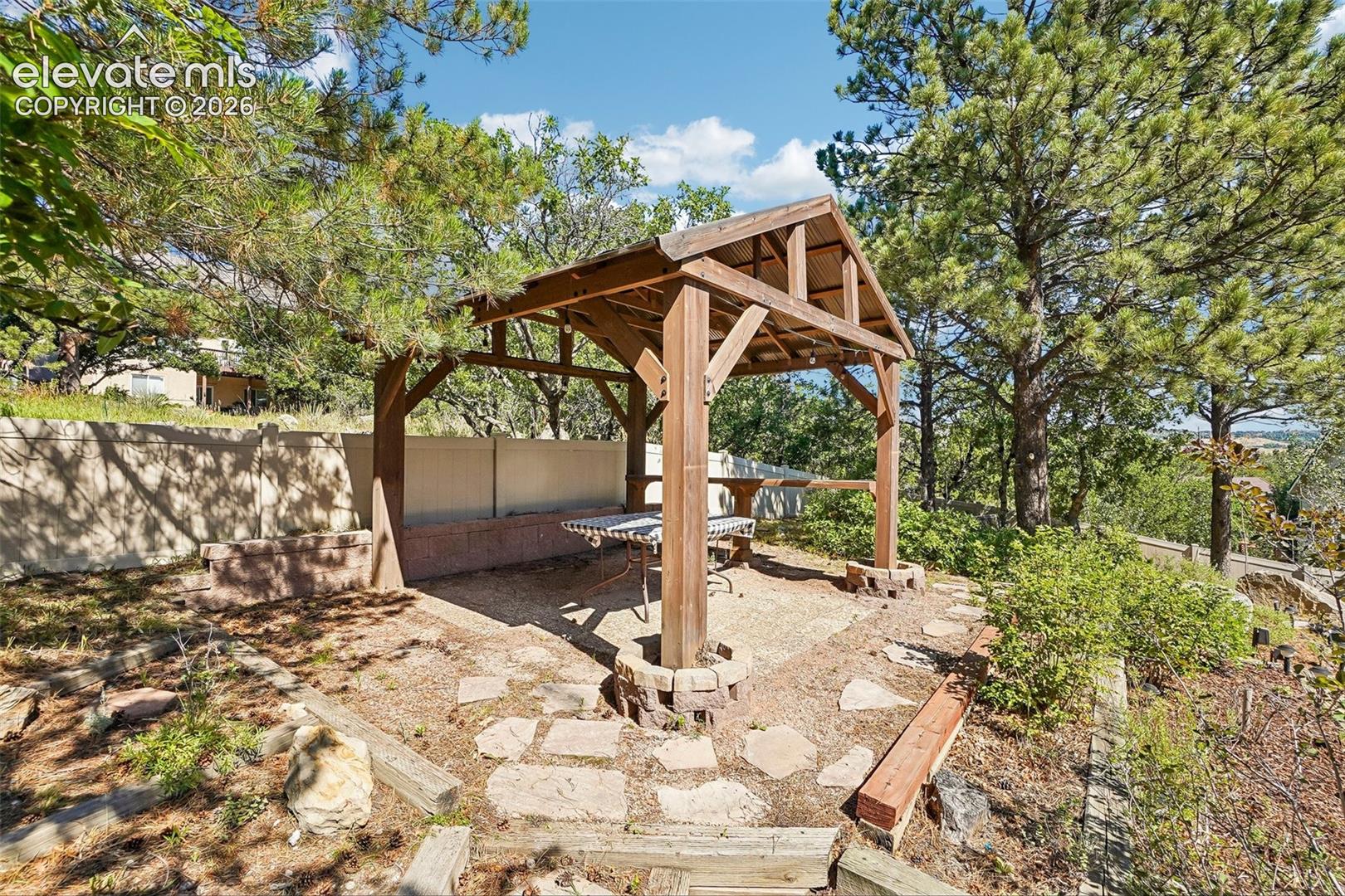 Pergola in large yard.