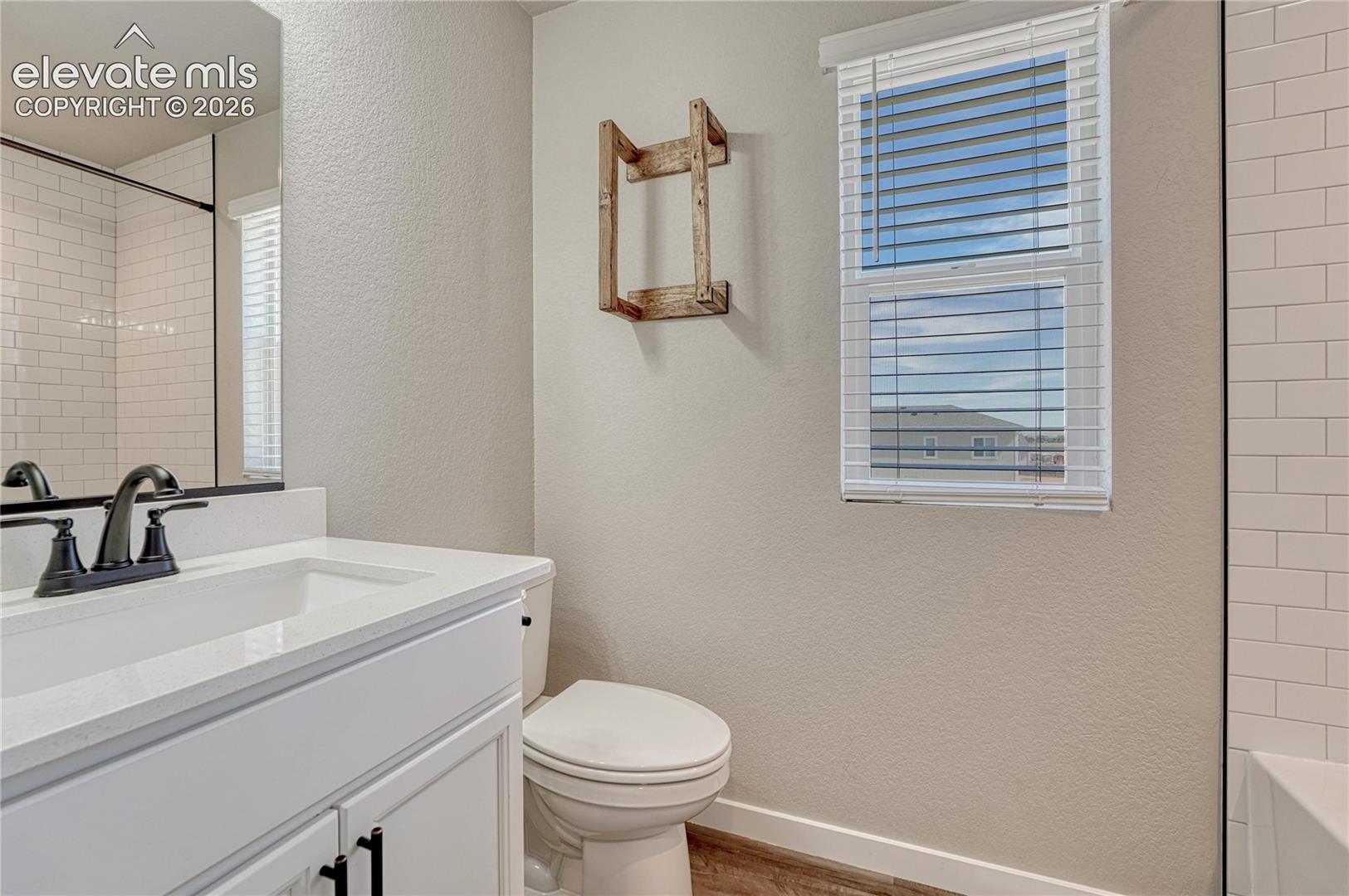 Full upstairs bath with quartz countertop...