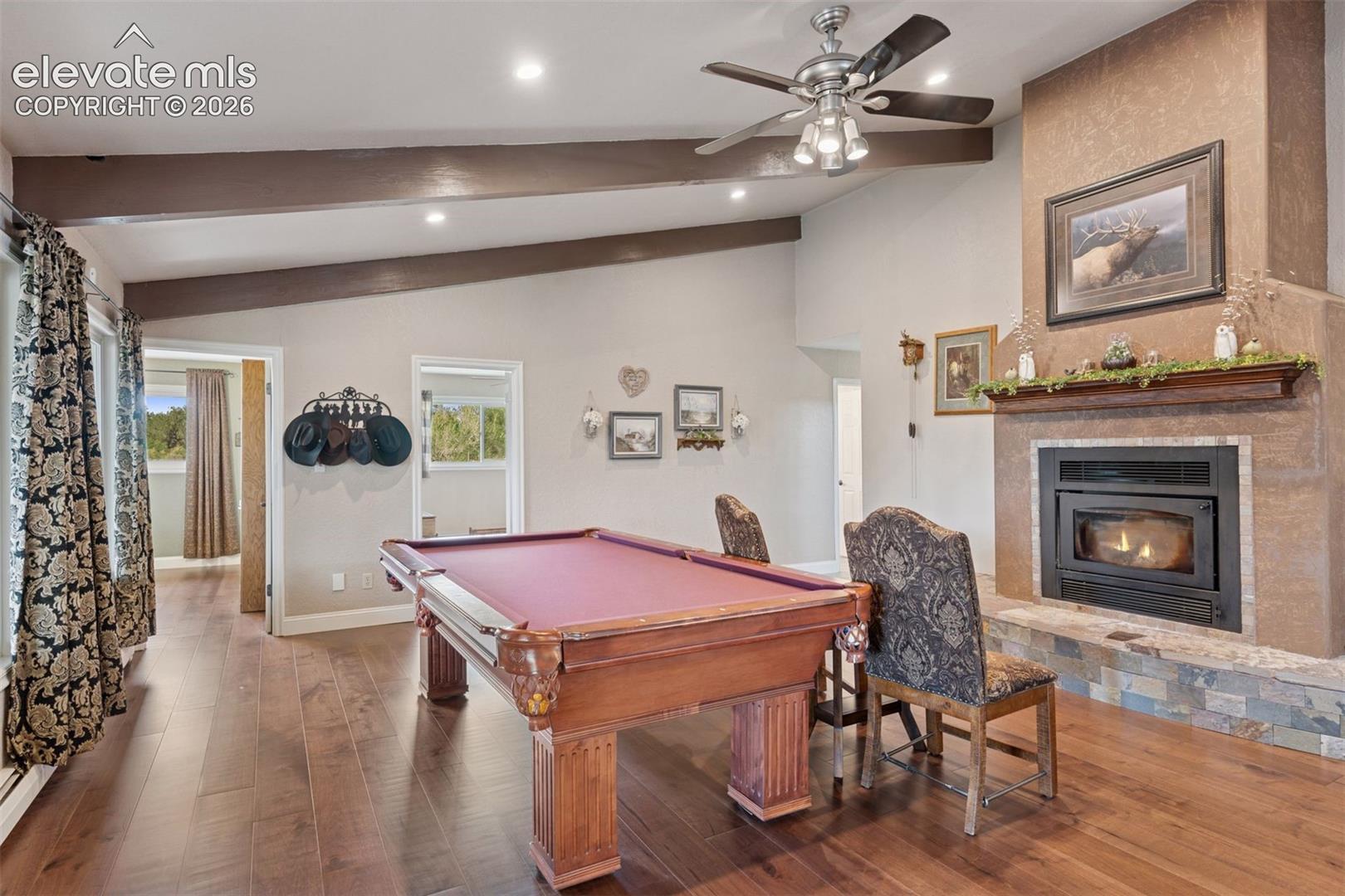 Family Room with Limestone Fireplace, Hardwood Floors & Built-Ins