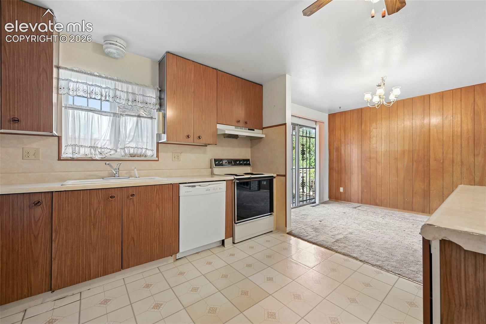 Kitchen opens to Dining Room and walkout to covered patio